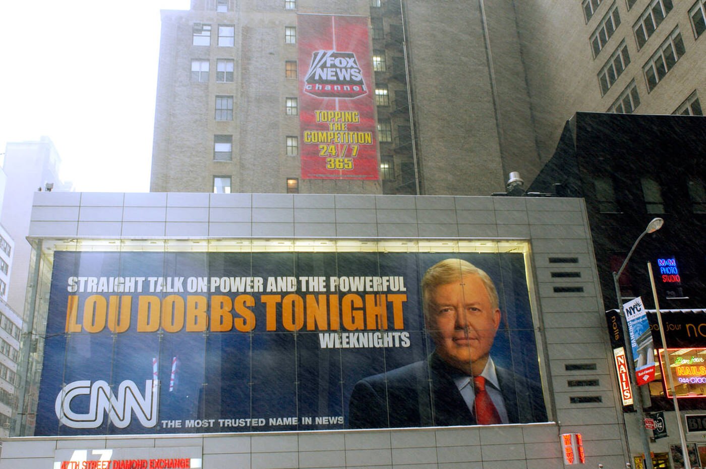 An Ad For Fox News Next To An Ad For Cnn On Sixth Ave Opposite The Cnn Studios, 2005.