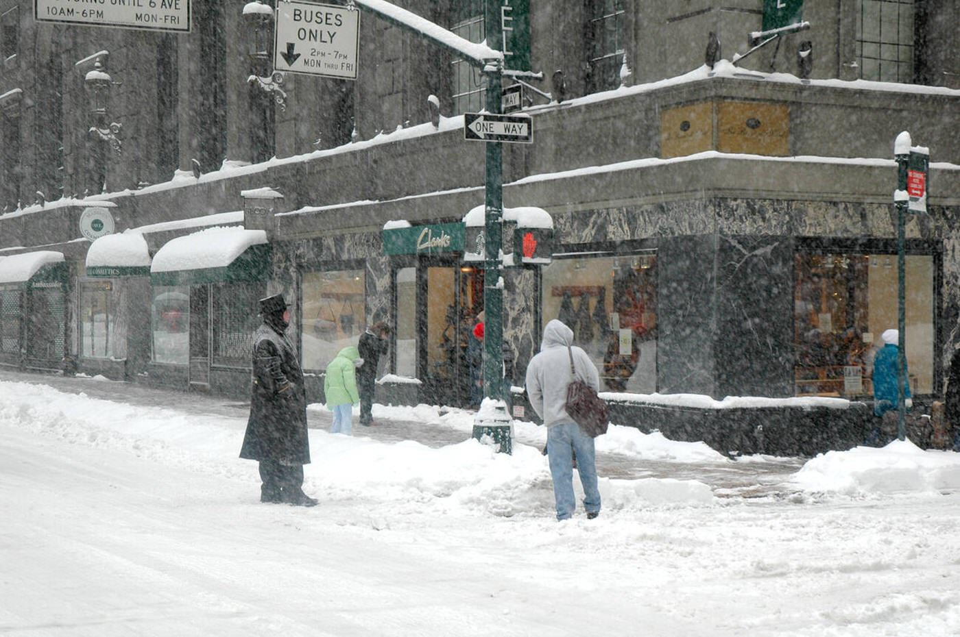 Doorman And Hotel Guest Stand On Empty Street Corner Of Madison Avenue During A Winter Storm, 2006.