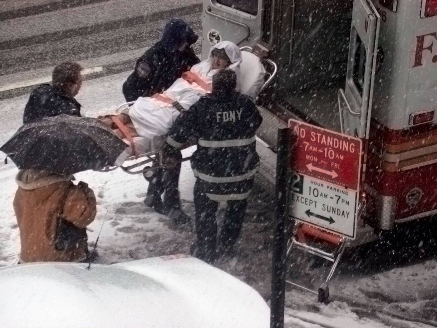 Emergency Service Personnel Move An Elderly Person To The Hospital During A Snowstorm, 2003.