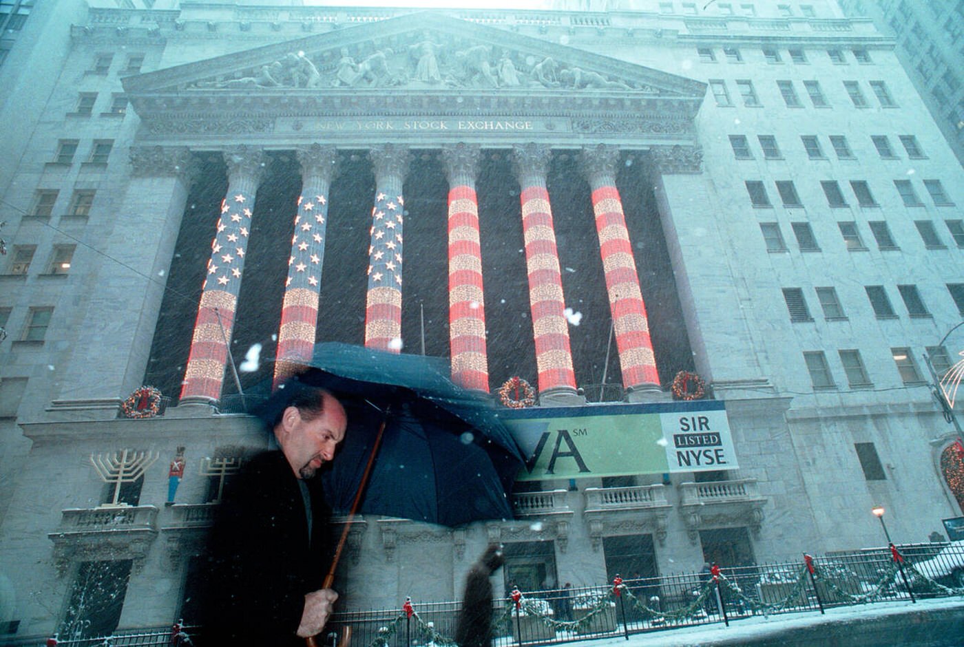 Wall Street Workers And Visitors Pass The New York Stock Exchange, Decorated For Christmas In The Snow, 2003.