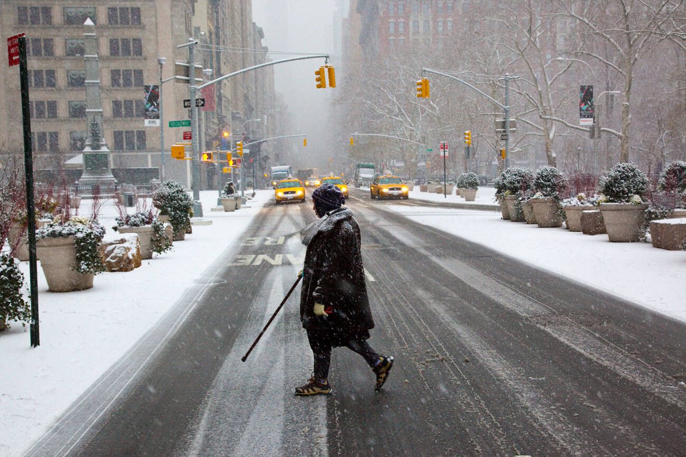 Crossing The Street During A Snowstorm In Manhattan, 2009.