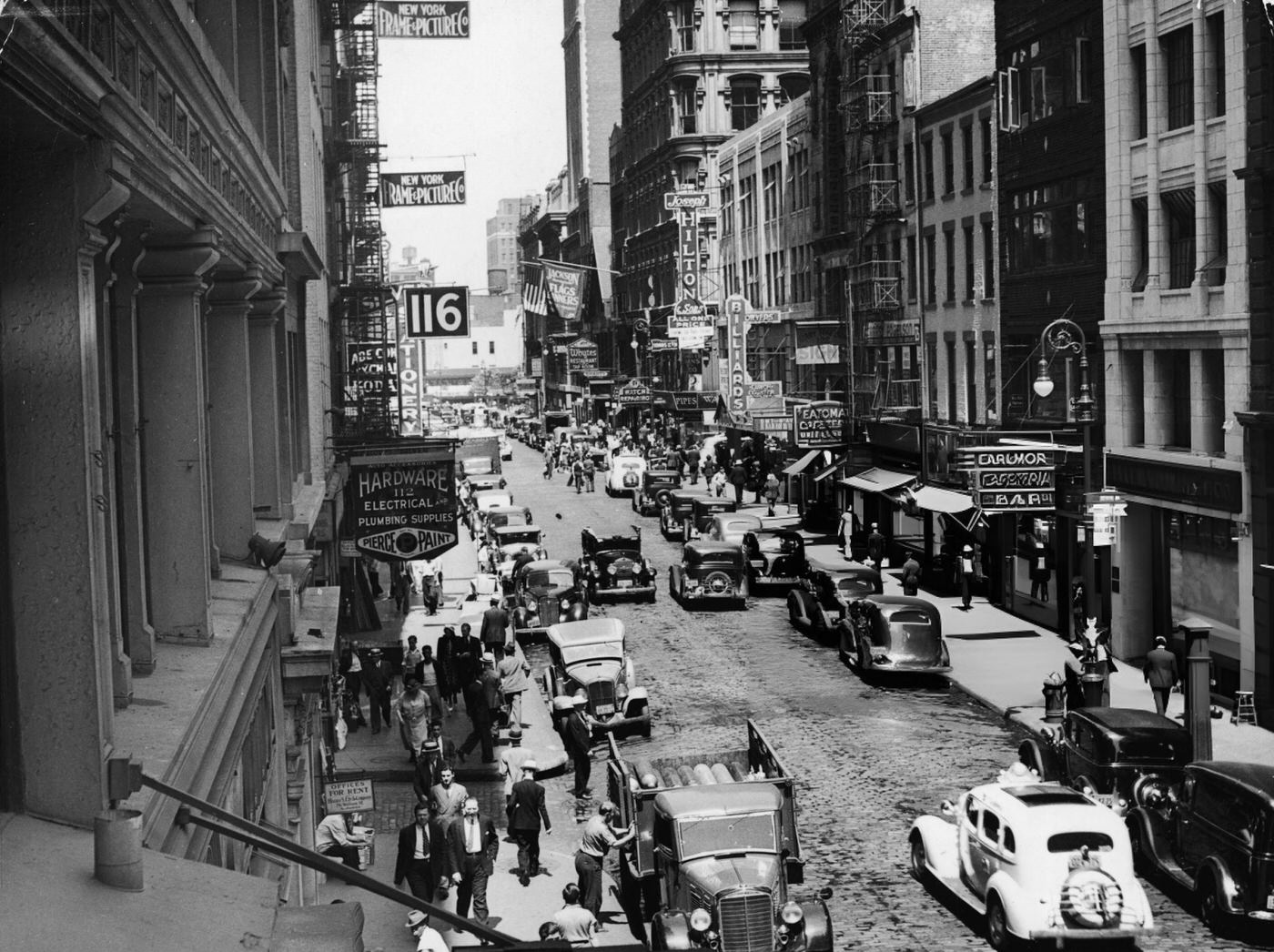 View Of Pedestrian And Vehicle Traffic Along Fulton Street At The Intersection Of Dutch Street, Near The Bmt And 8Th Avenue Subway Station, New York, 1930S.