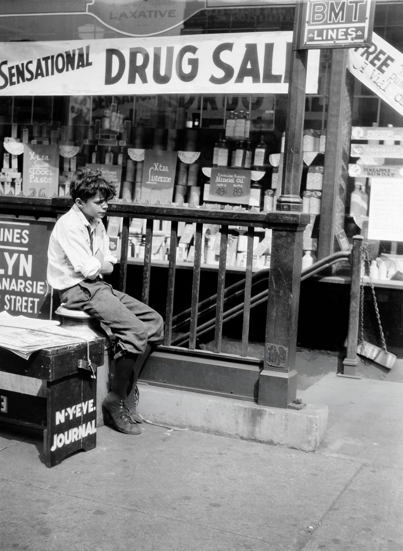 A Newsboy Next To The Bmt Subway Entrance, New York City, Circa 1930.
