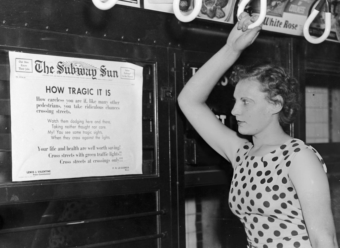 Subway Rider Elenor Comstock Reads A Public Service Announcement Poster With Poetry By Mayor Fiorello H. La Guardia Regarding Traffic Safety, August 9, 1935.