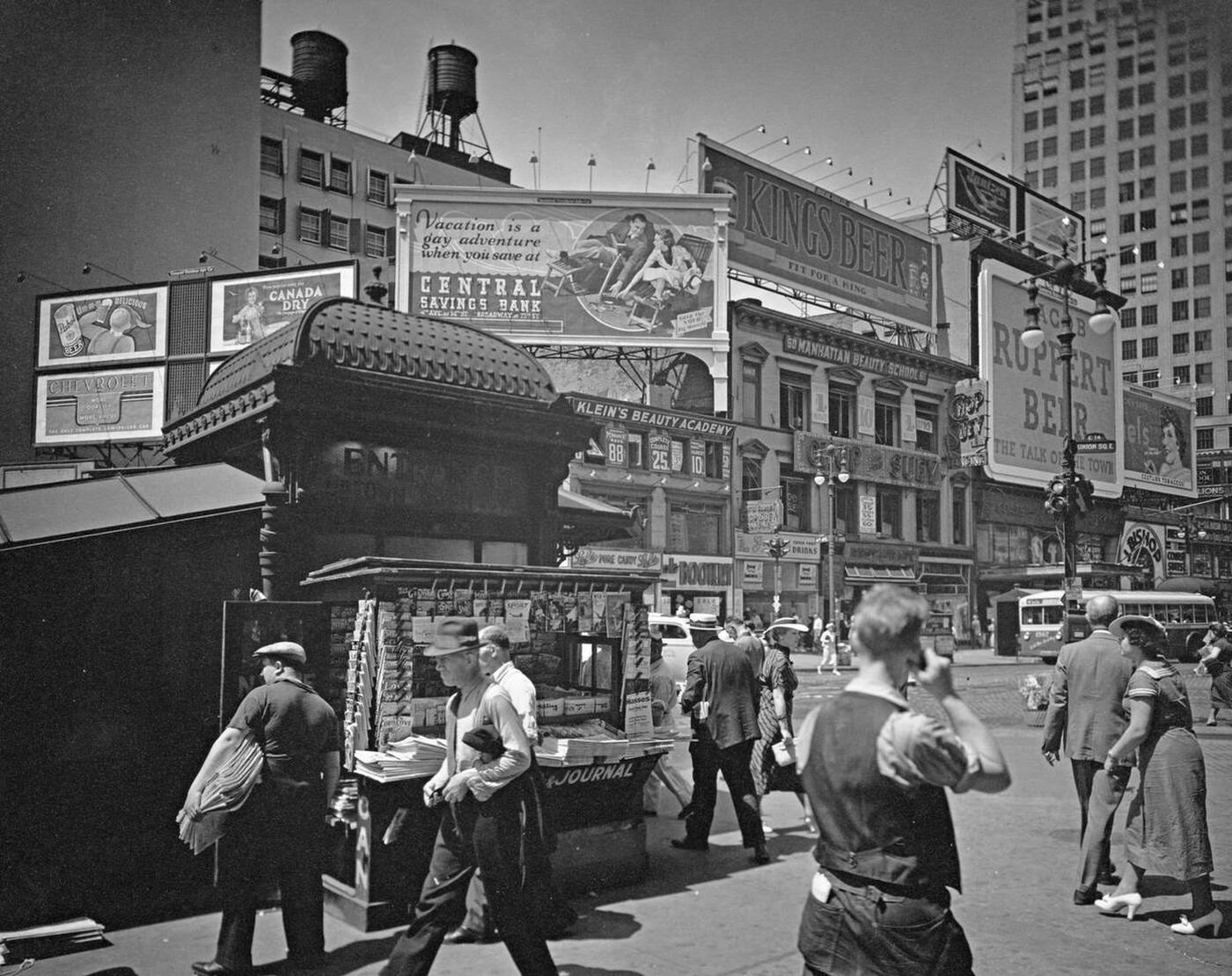 Men And Women Hurry Past A Newsstand Outside An Uptown Subway Entrance At Union Square, Manhattan, Circa 1936.