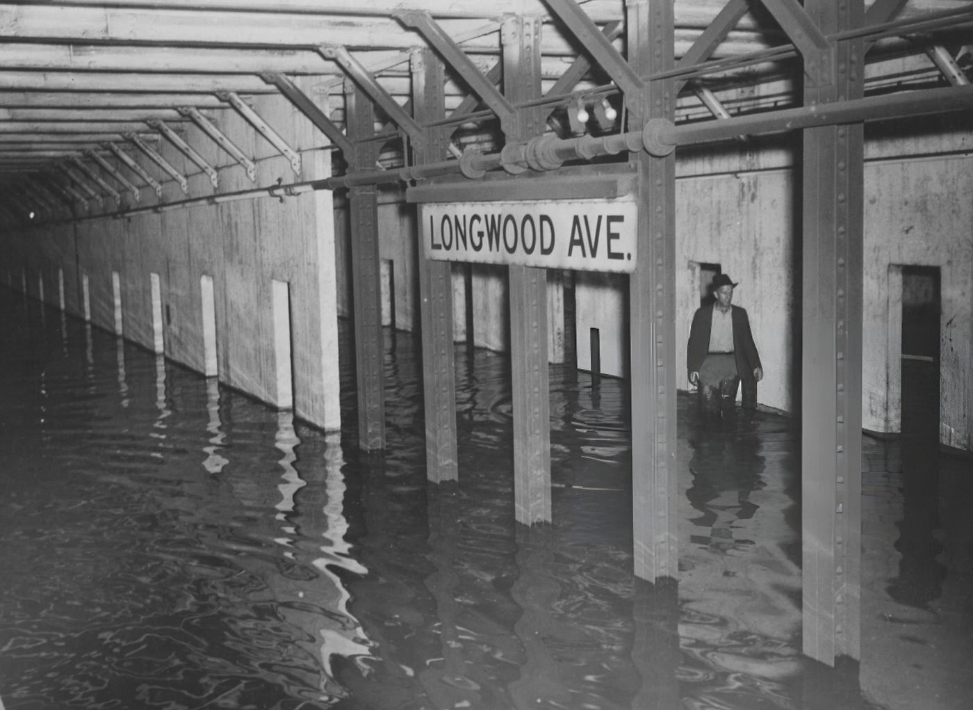 Subway Rider Elenor Comstock Reads A Public Service Announcement Poster With Poetry By Mayor Fiorello H. La Guardia Regarding Traffic Safety, August 9, 1935.