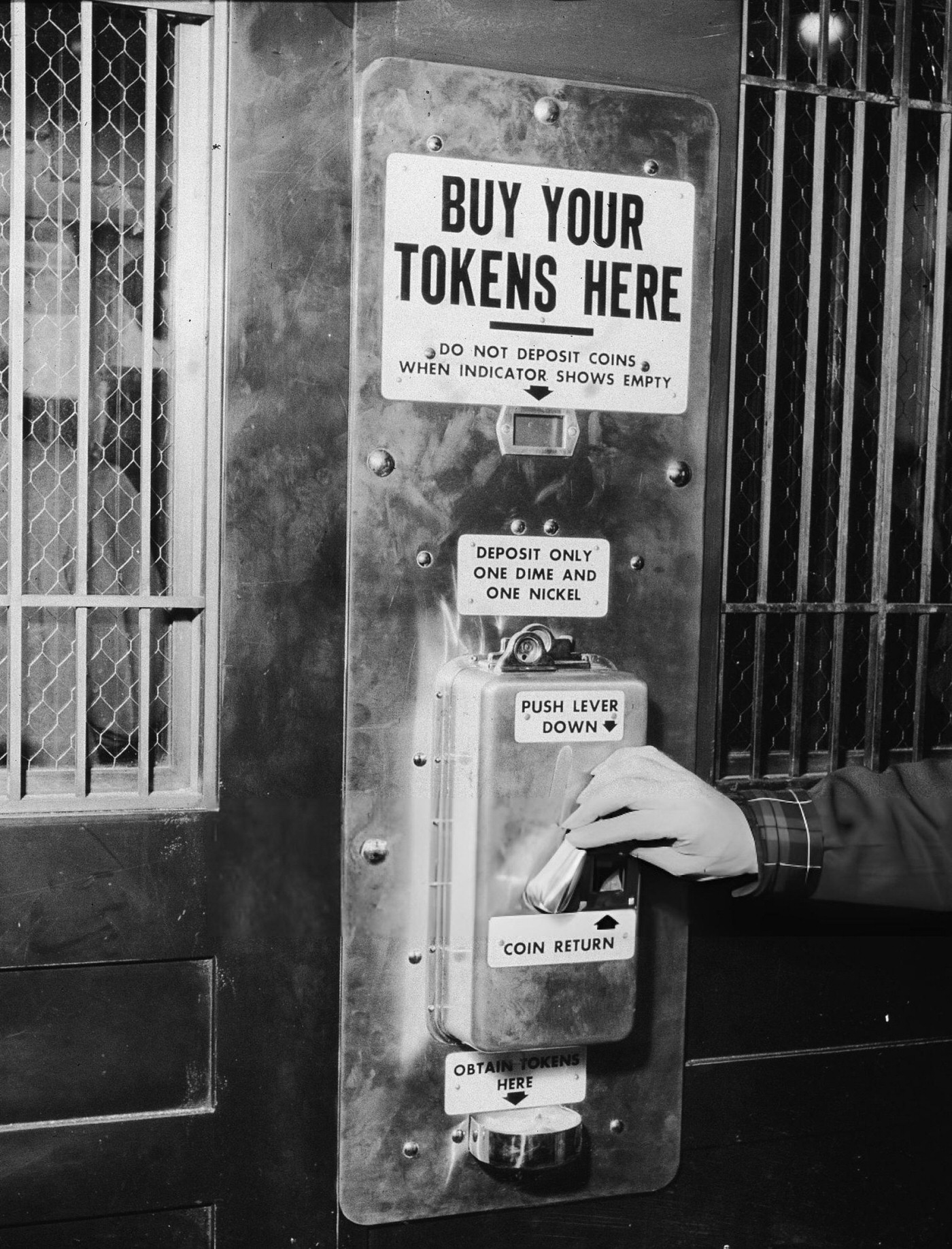 A Male Hand Depresses A Lever On The First Subway Token Vending Machine At Sixth Avenue And 40Th Street In New York, April 19, 1954, With The Fare Indicated As Fifteen Cents.