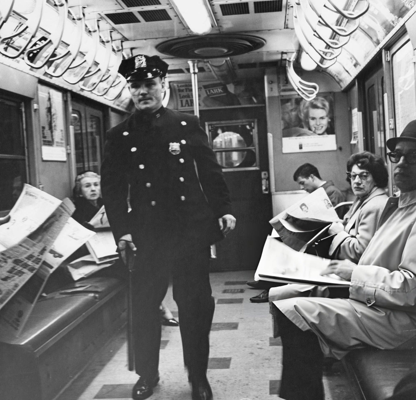 Nypd Patrolman Don Matthews Keeps Watch On A Subway Train In New York City, Circa 1955.