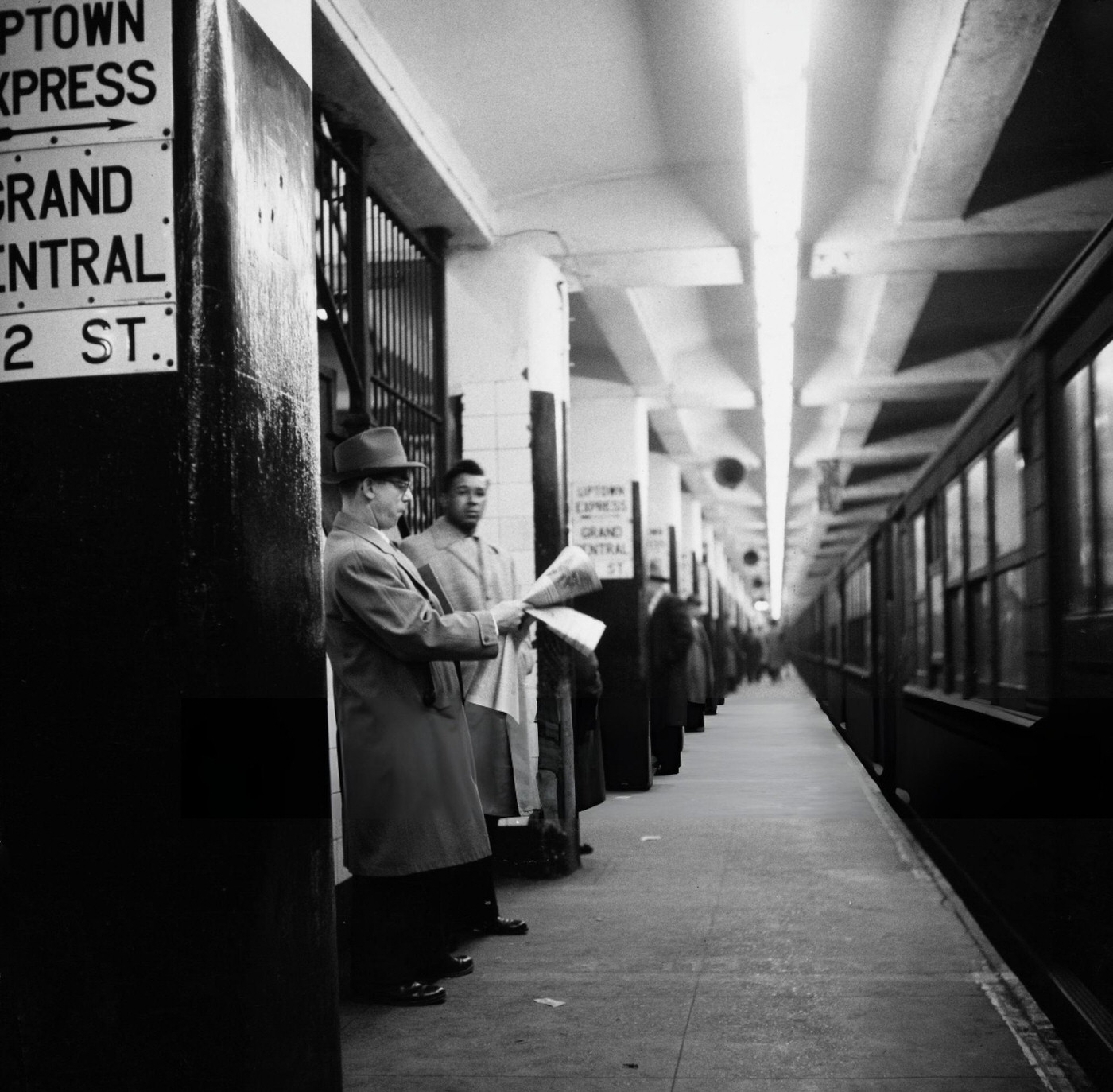 People On The Platform As A Train Pulls Into A Nyc Subway Station, Circa 1955.