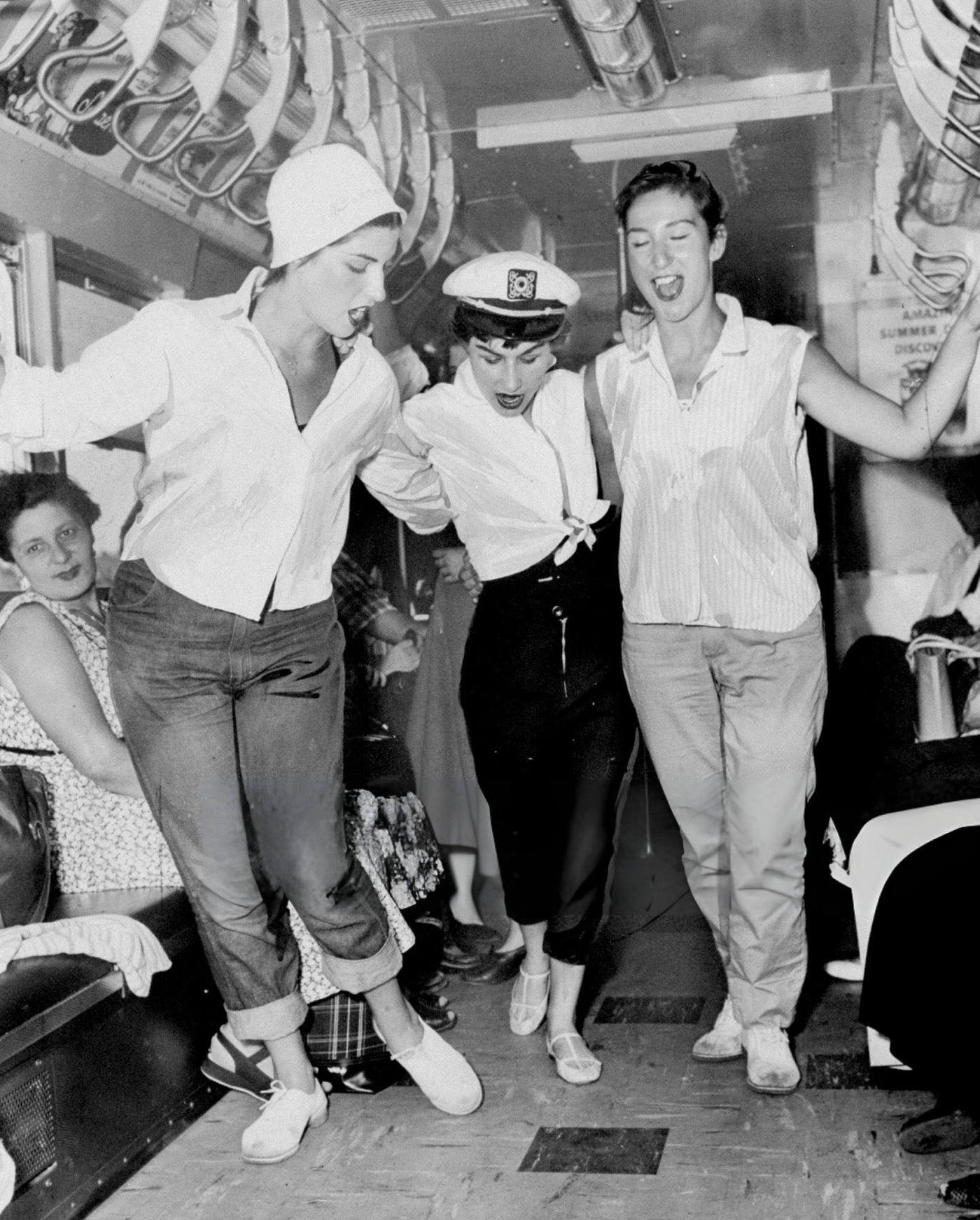 Judy Martinez, Jeanne Martinez, And Diana Montalvano Dance On A New Air-Conditioned Subway Car, July 11,