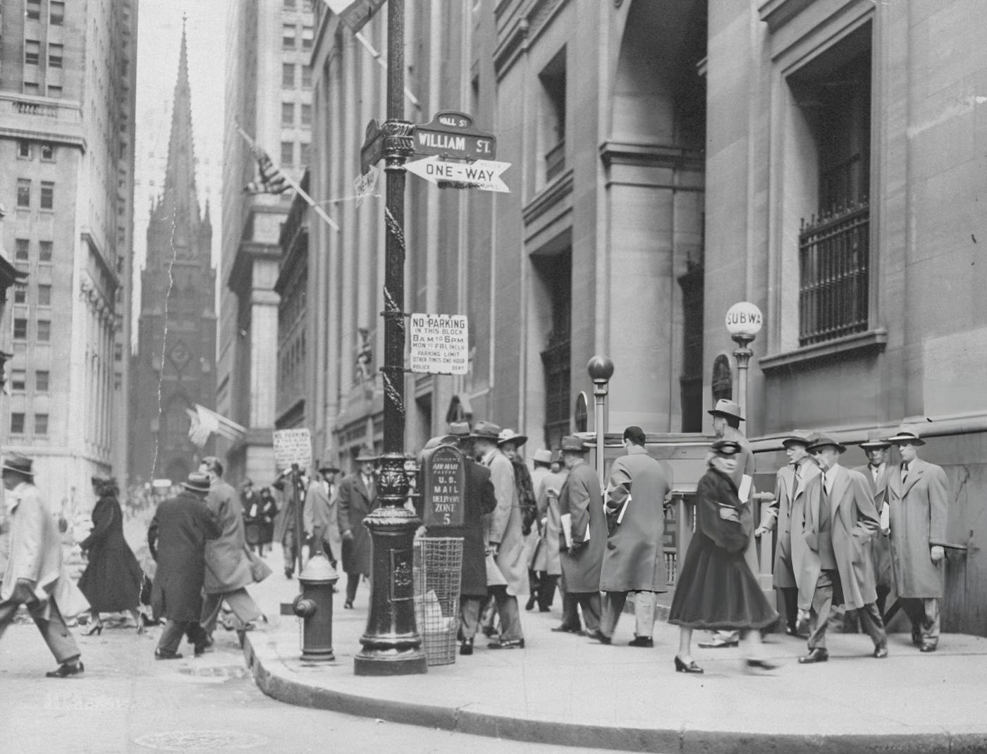 Crowds Leave The Subway Station At Wall And William Streets, With Trinity Church In The Background.
