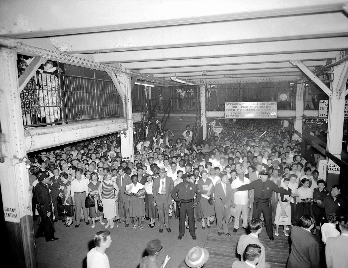 Cops Tackle A Crowd Jam At The Grand Central Subway Shuttle Terminal, With Southbound Riders Heading To The Seventh Ave. Line Due To A Wanamaker Fire.