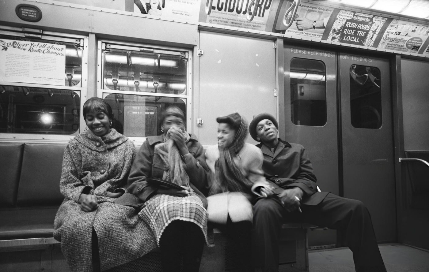 Four Young Adults Share A Laugh On The Subway In New York City, February 1959.