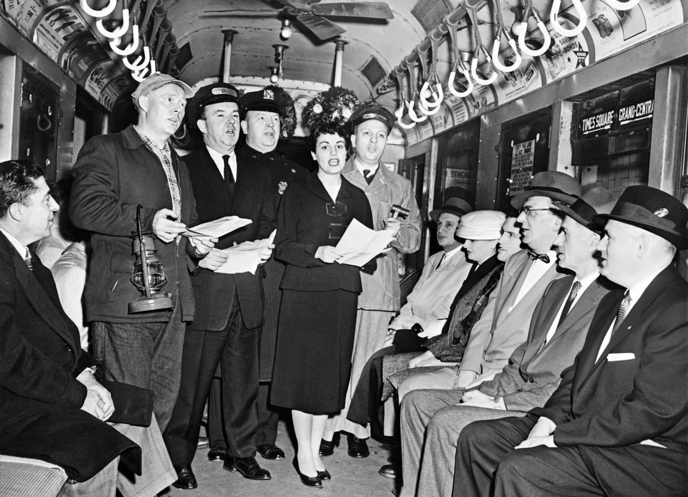New York City Transit Personnel Sing In Chorus To Distract Subway Passengers, December 15, 1956.