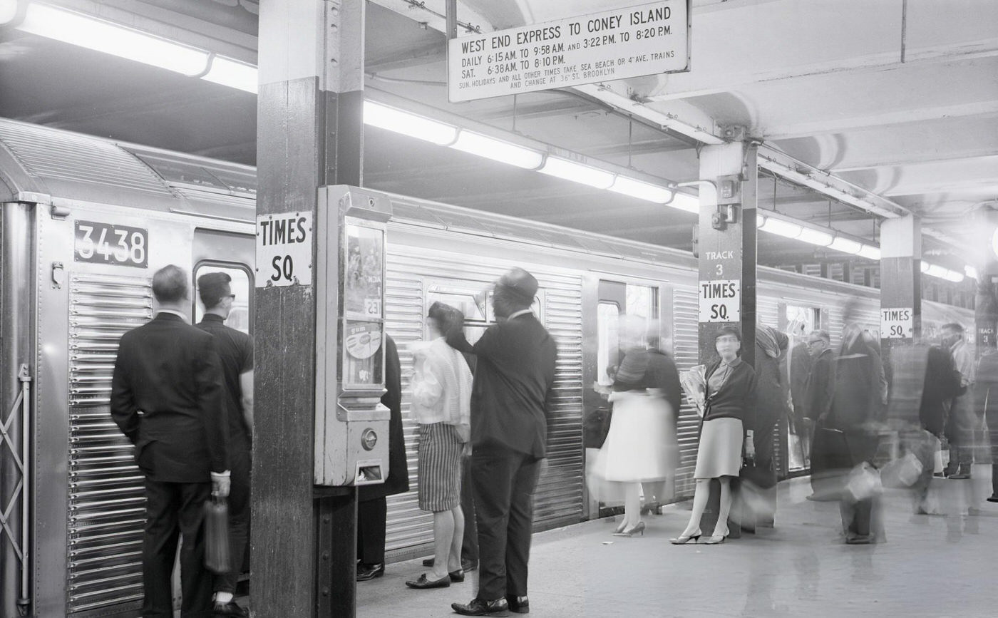 Subway Station In Times Square With A Train Taking On Passengers, New York City.