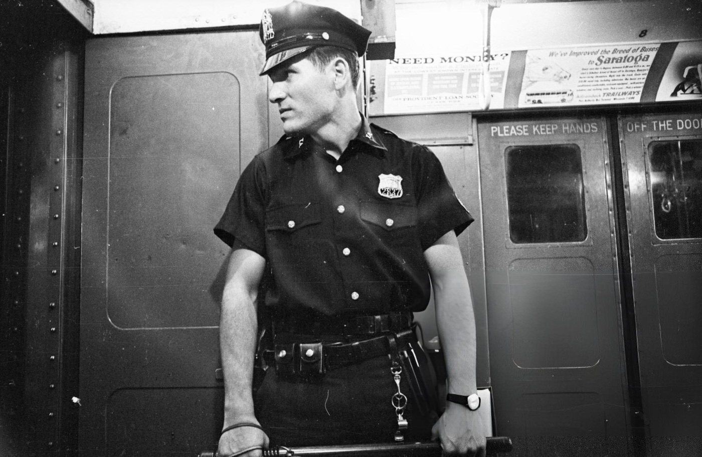 A Policeman On Patrol In The New York Subway, August 11, 1965.