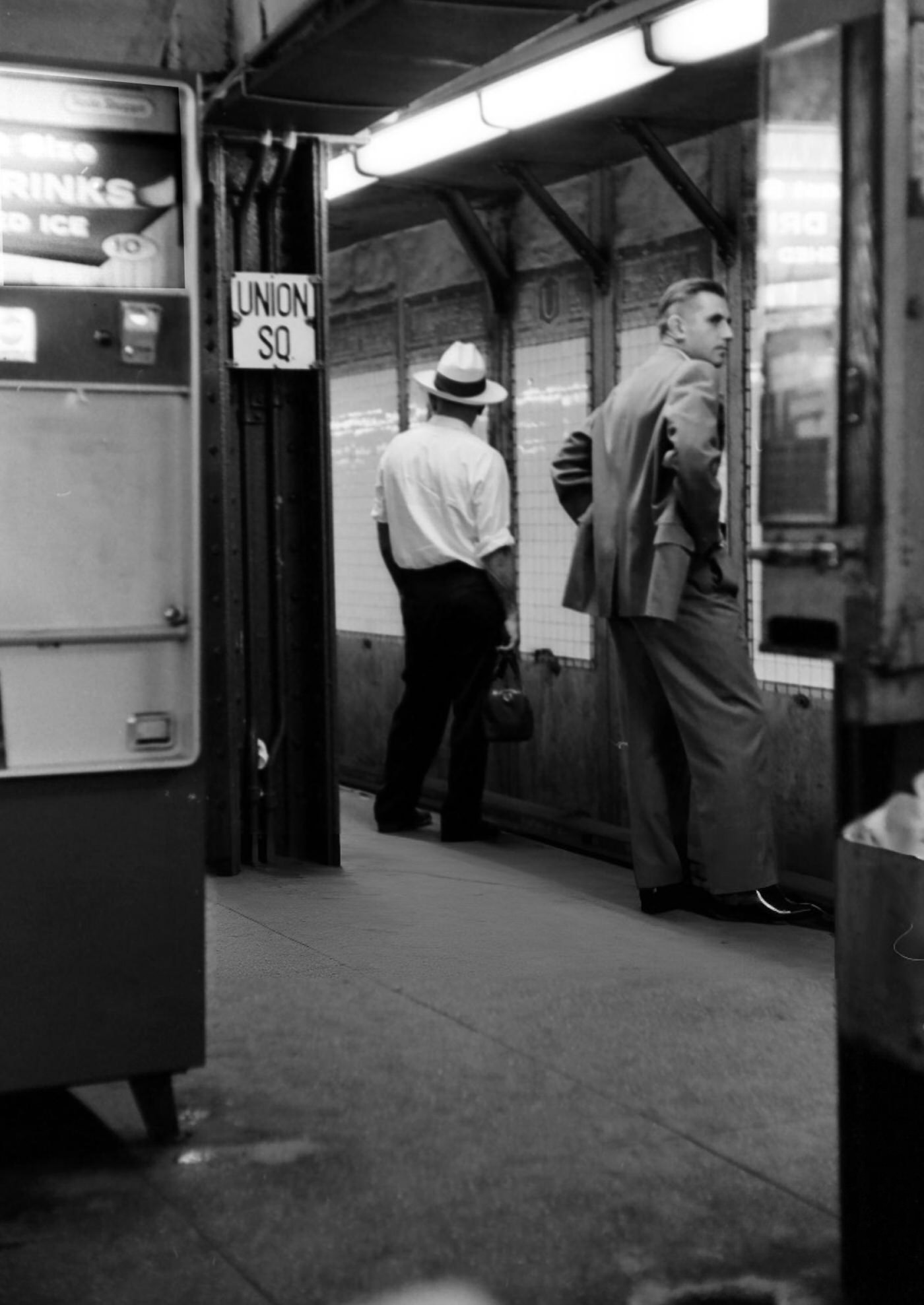 Two Men Waiting For The Train At The Union Square Subway Stoop In New York City, Circa 1965.