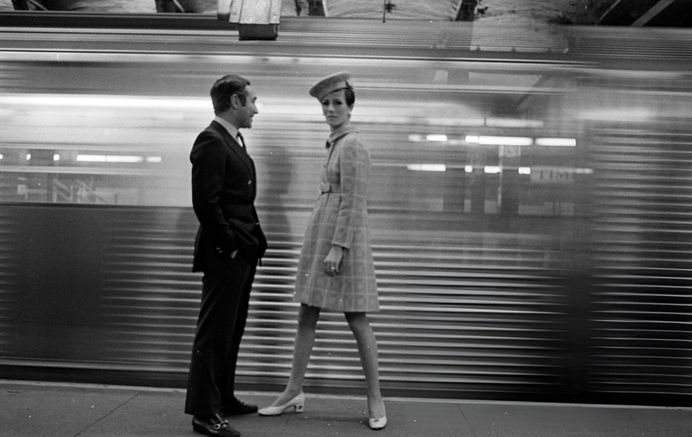 Designer Chester Weinberg With A Model In A Look From His Spring Collection And Hat By Adolfo Sardina On The New York City Subway, 1968.