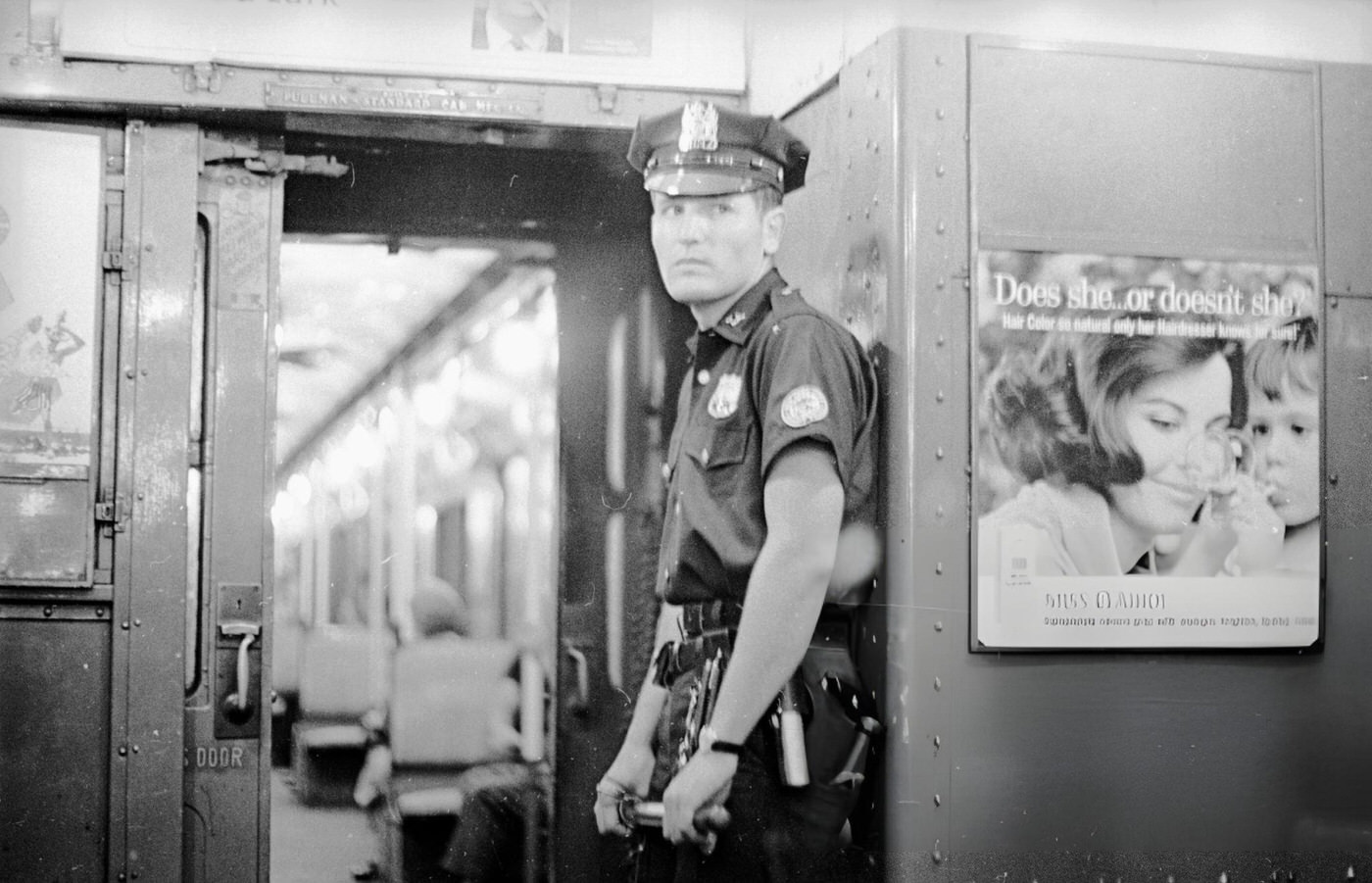 A Policeman On Patrol In The New York Subway, August 11, 1965.