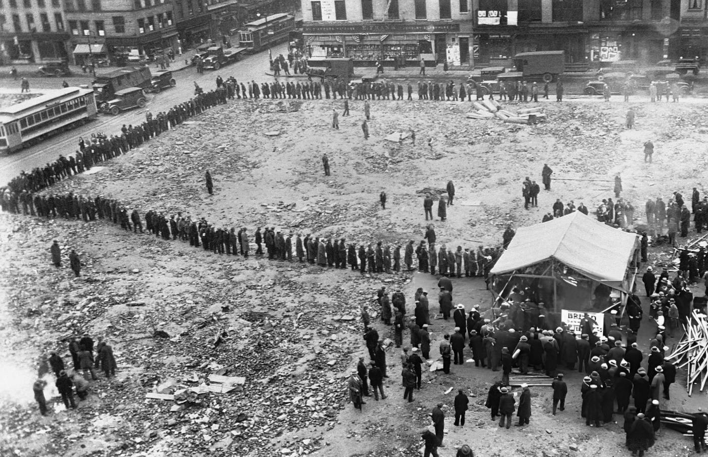 Unemployed People Wait In Line At Grand And Christie Streets In Nyc For Nourishment, Despite Heavy Rain.