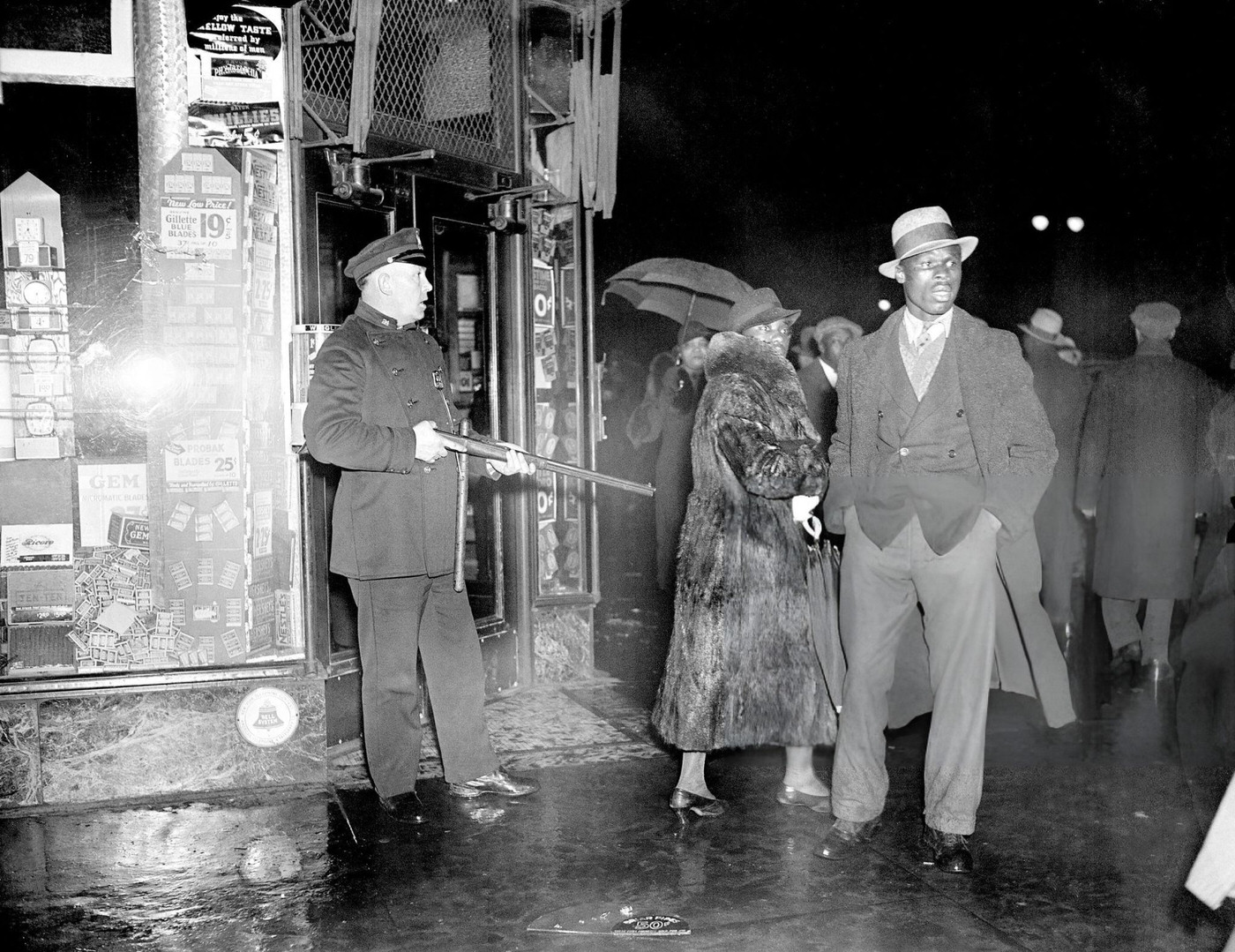 A Policeman Guards A Drugstore During Rioting In Harlem, March 19, 1935, Which Began After A Minor Incident Escalated Due To Economic Tensions During The Great Depression.