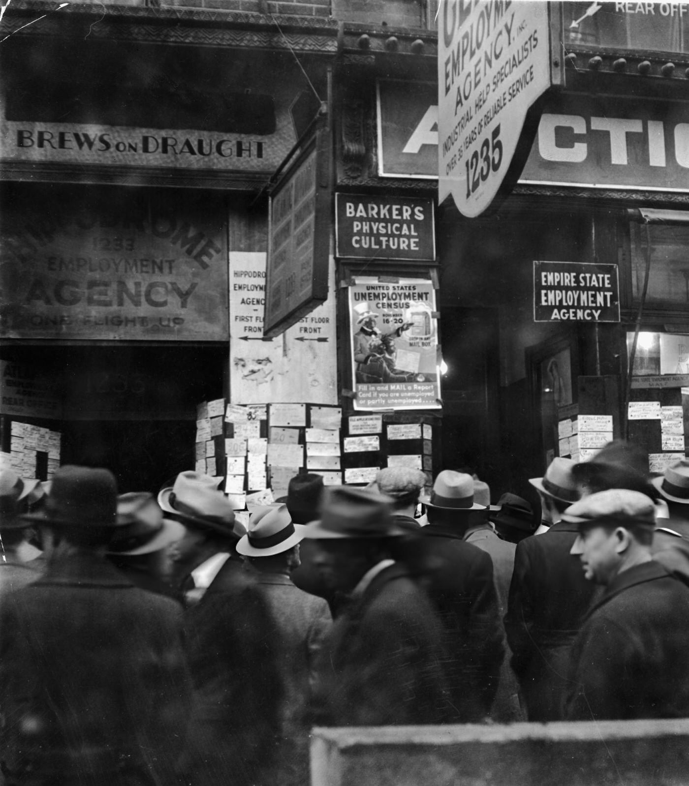 A Crowd Of Unemployed Men Gather In The Rain In Front Of Employment Agencies On Sixth Avenue, New York City, 1931.