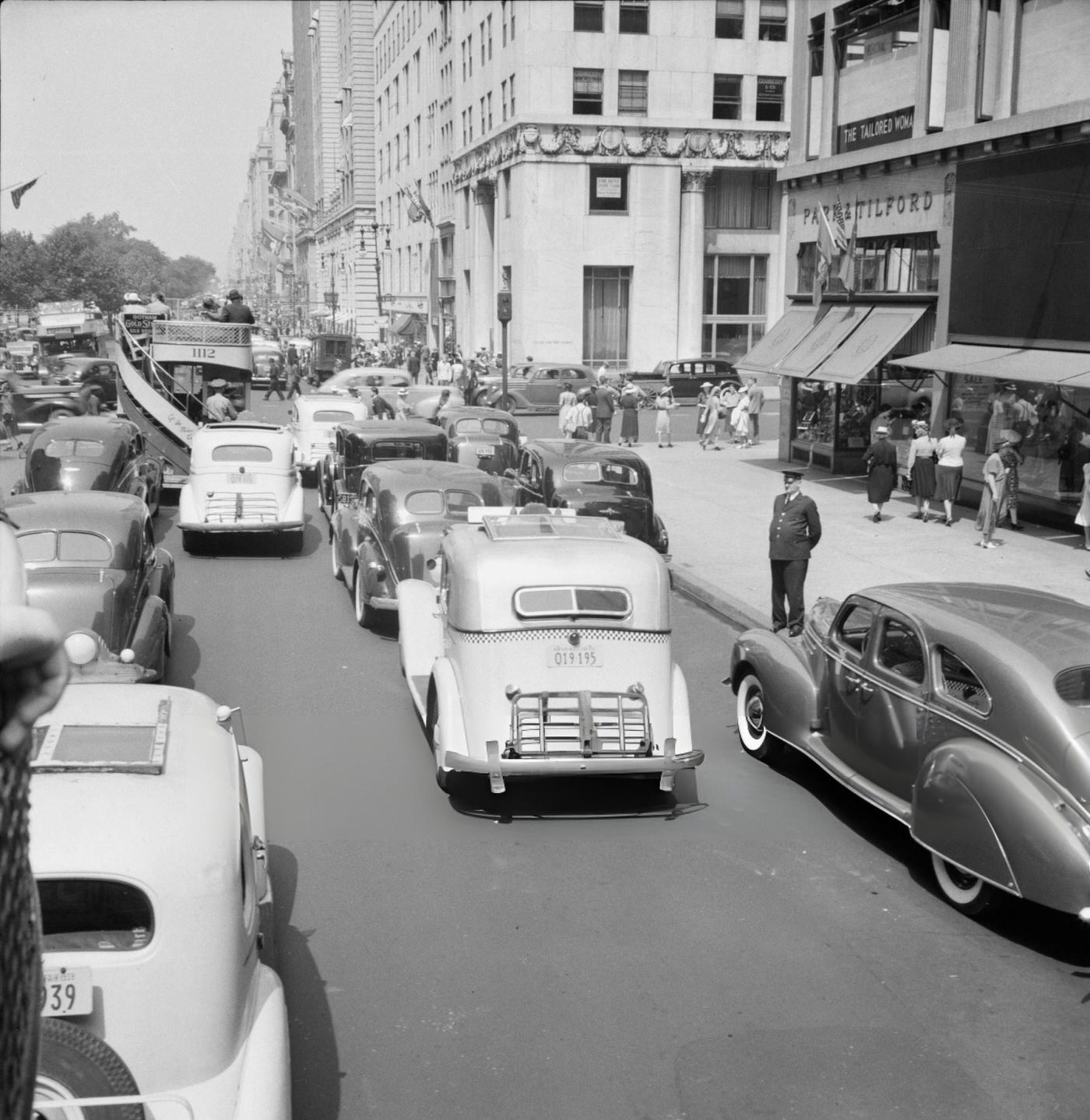Traffic On Fifth Avenue Approaching 57Th Street On A Summer Afternoon, New York City.