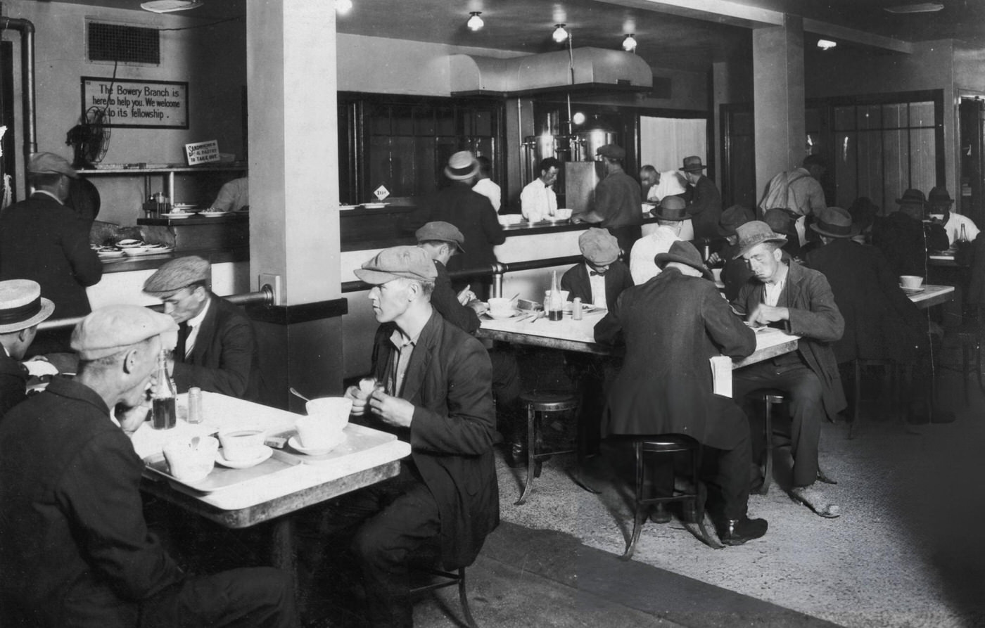 Impoverished Men Eat A Meal Of Soup And A Sandwich In A Cafeteria-Style Restaurant On The Bowery, New York City.