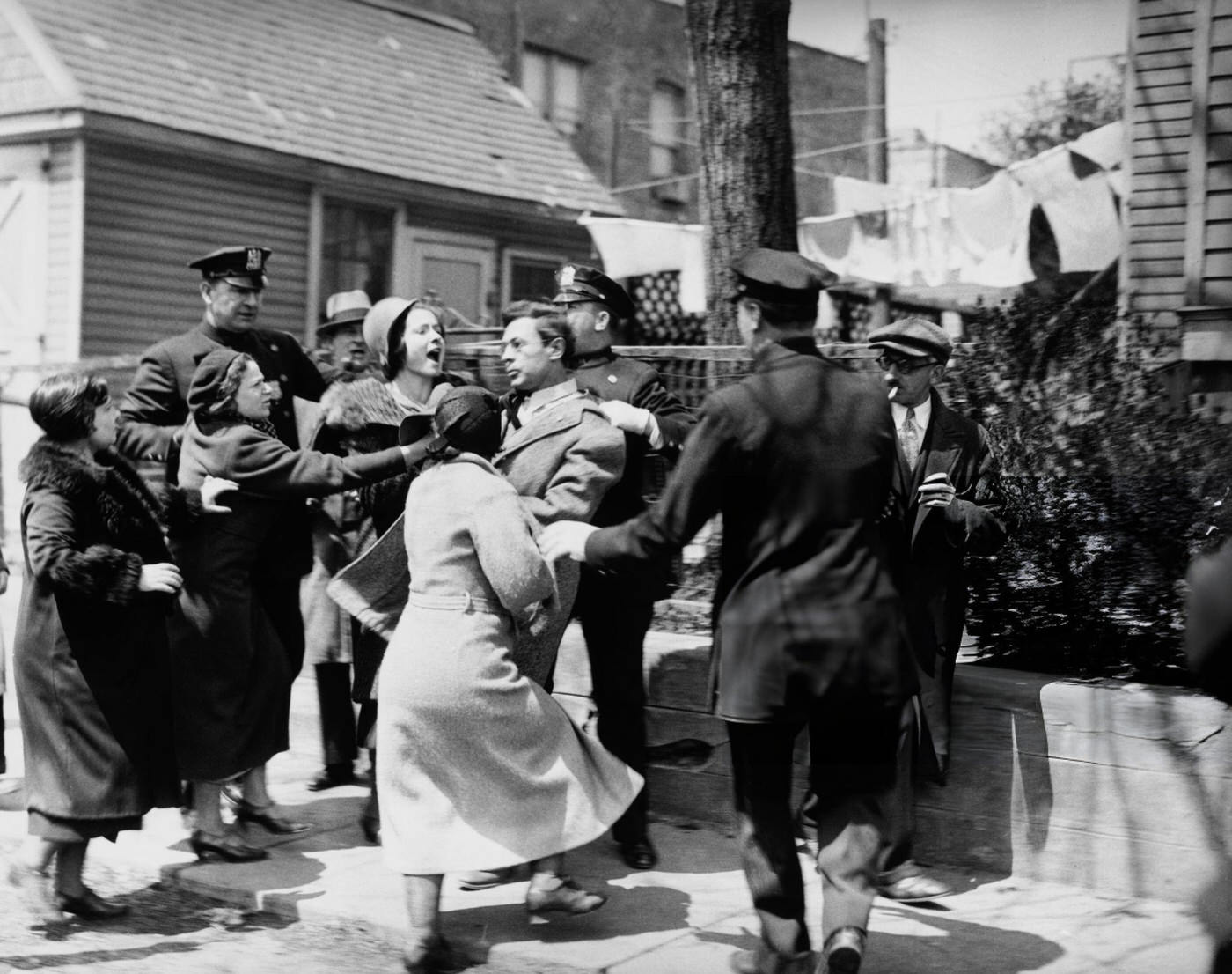 Women Rush To Assist A Man Under Arrest During Unemployed Protests Outside The Home Relief Bureau In Brooklyn, April 28, 1933.