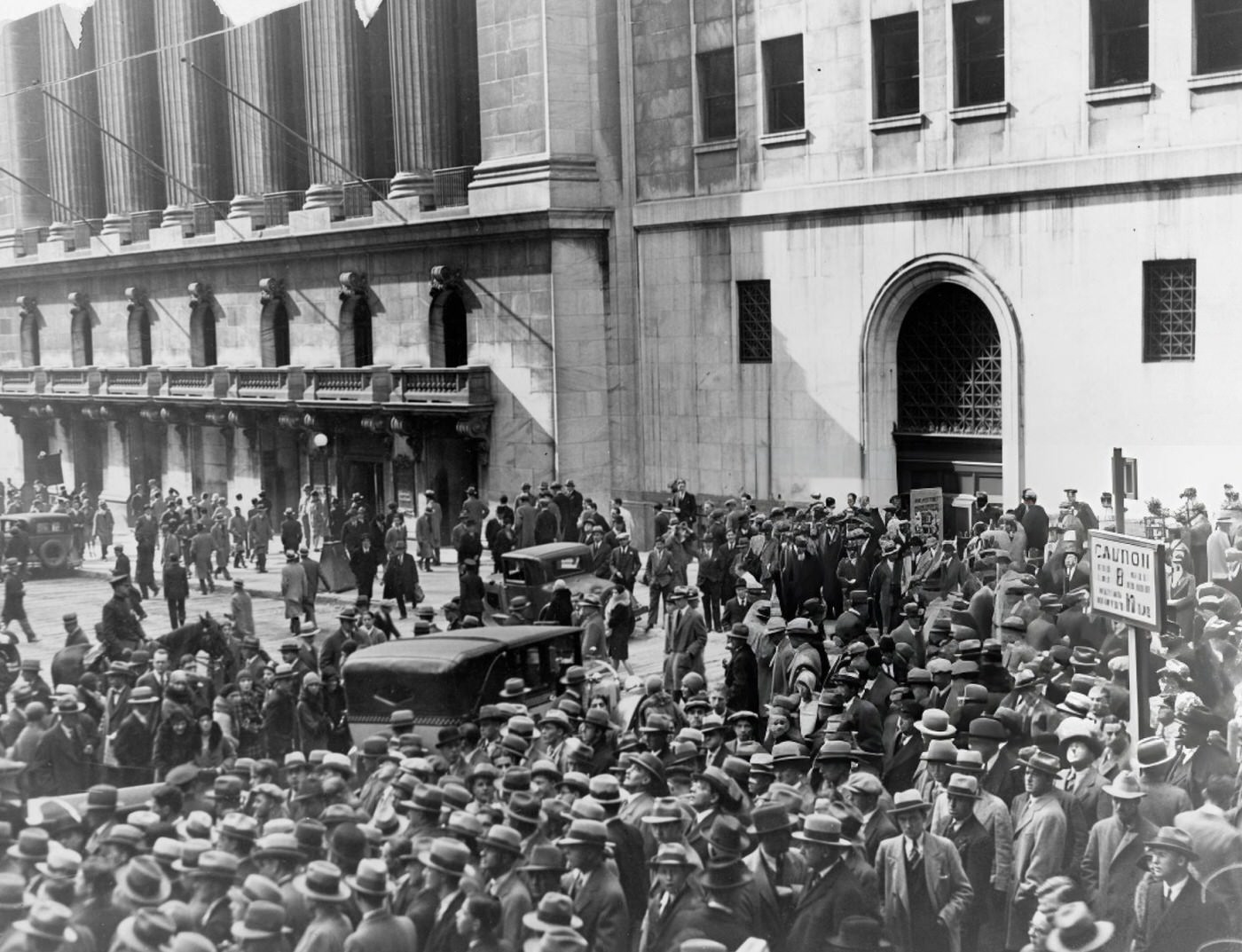 Elevated View Of A Crowd Gathered Outside The New York Stock Exchange Following The Stock Market Crash, Late 1929.