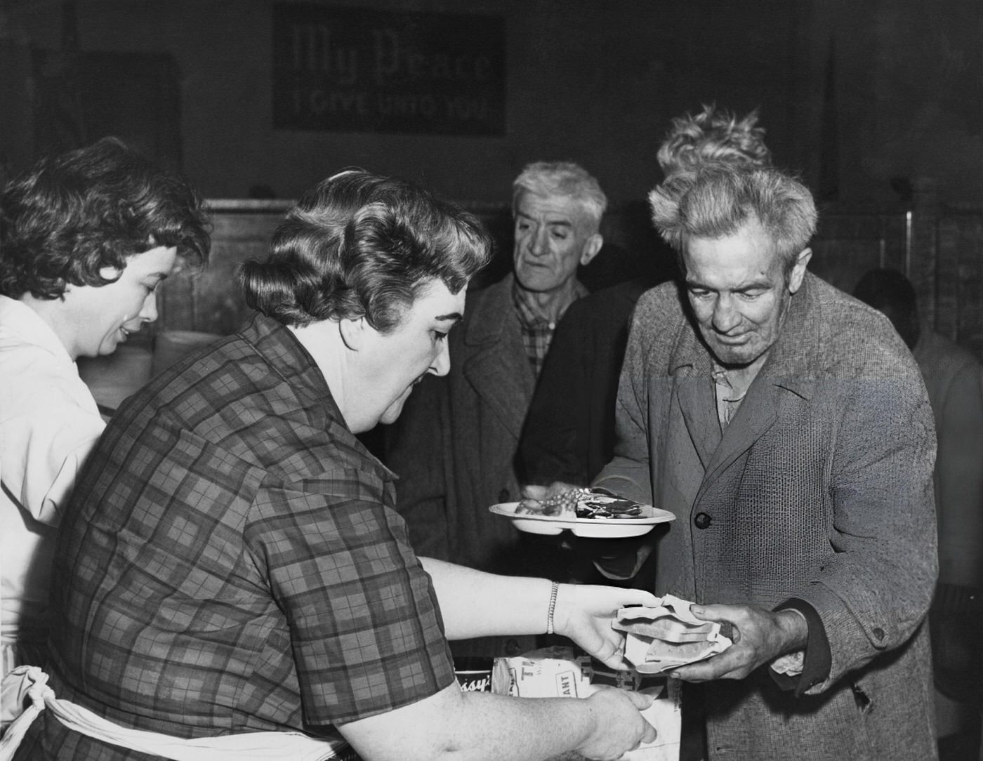 Thanksgiving Dinner Is Served To The Homeless By The Volunteers Of America At The Bowery Tabernacle, Circa 1935.