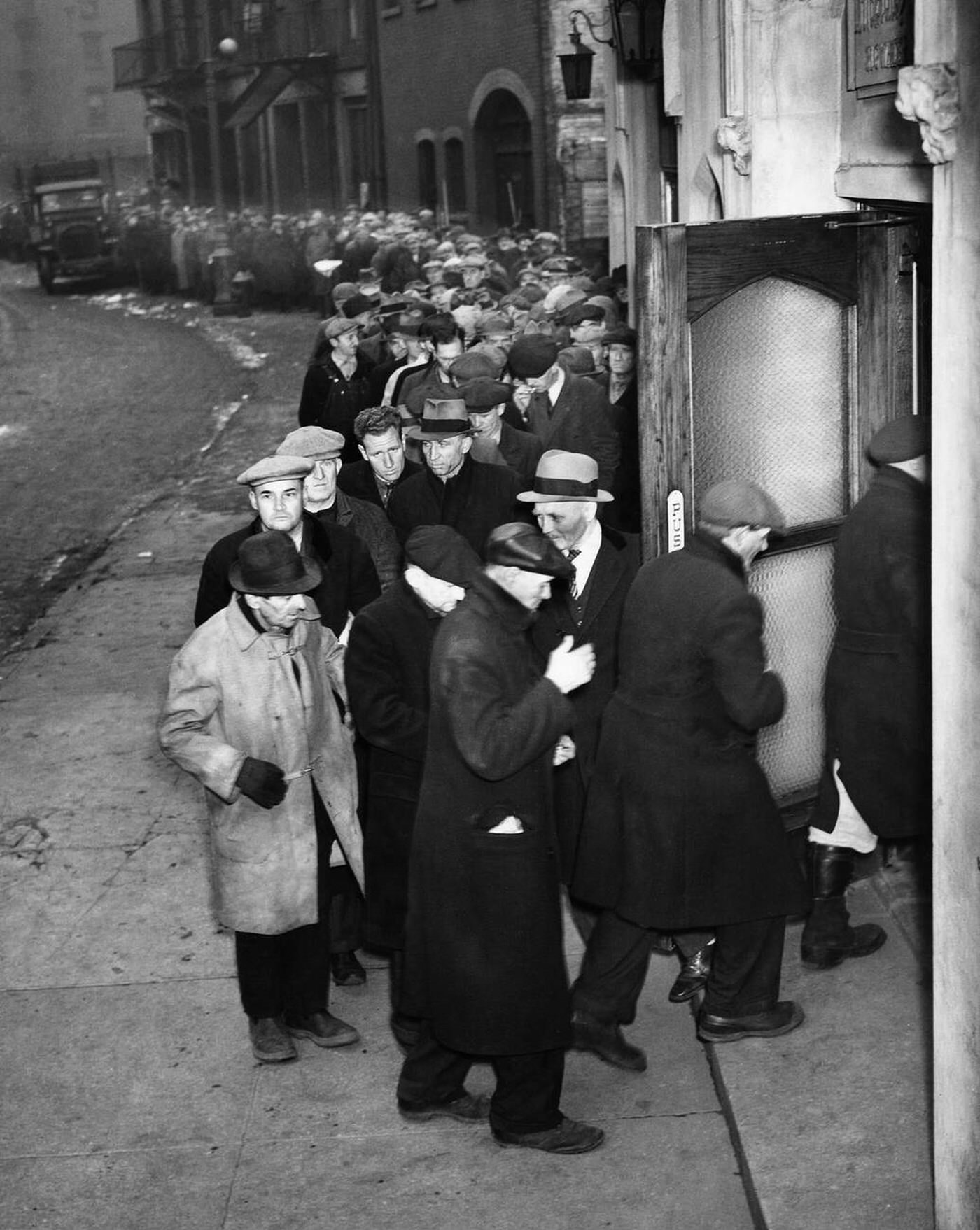 Men Standing On A Bread Line Outside The Water Street Mission In New York City, Circa 1930.