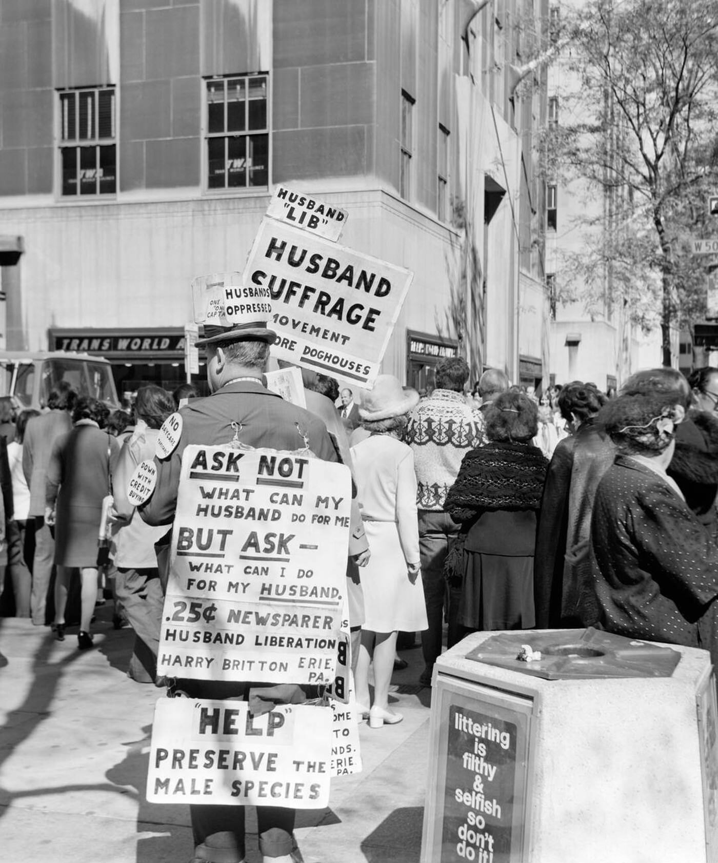 Man On 5Th Avenue Wearing Sandwich Board With Signs Advocating Husband Suffrage, 1975.