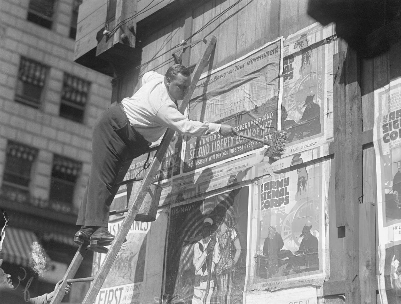 Fatty Arbuckle Putting Up Liberty Loan Posters In Times Square, 1917.