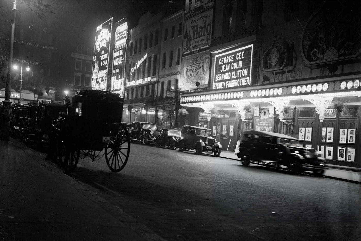 Hansom Cabs And Cars Drawn Up Outside The Alhambra Theatre In Leicester Square, London, 1935.
