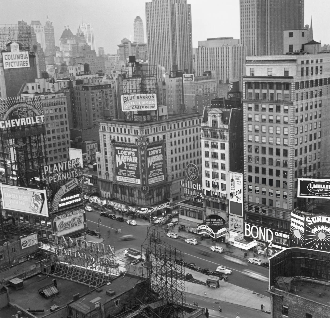 Overhead View Of Times Square During The Day, With Blurred Cars And The New York City Skyline, 1938.