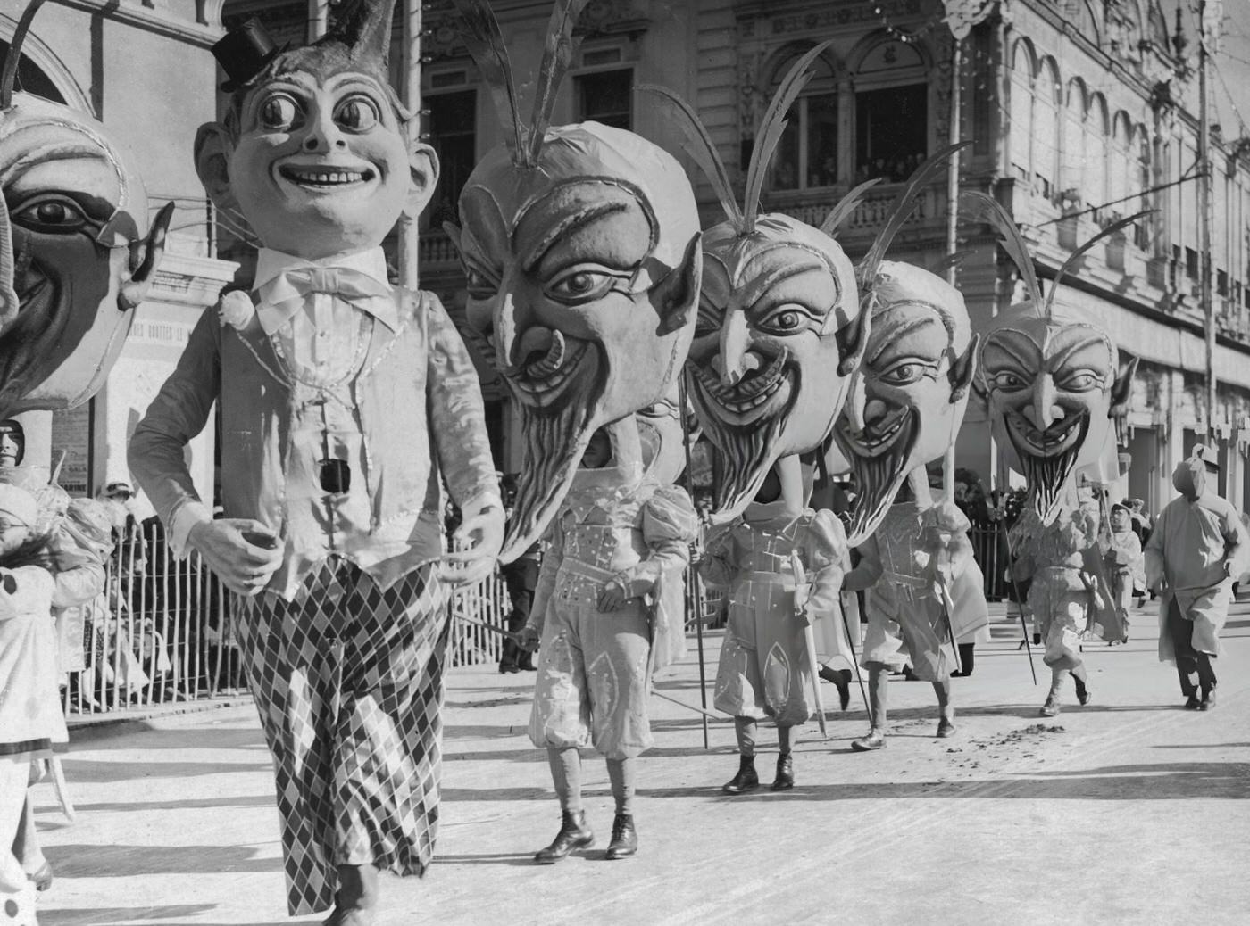 Figures In The Nice Carnival Passing Through The Main Square, 1938.