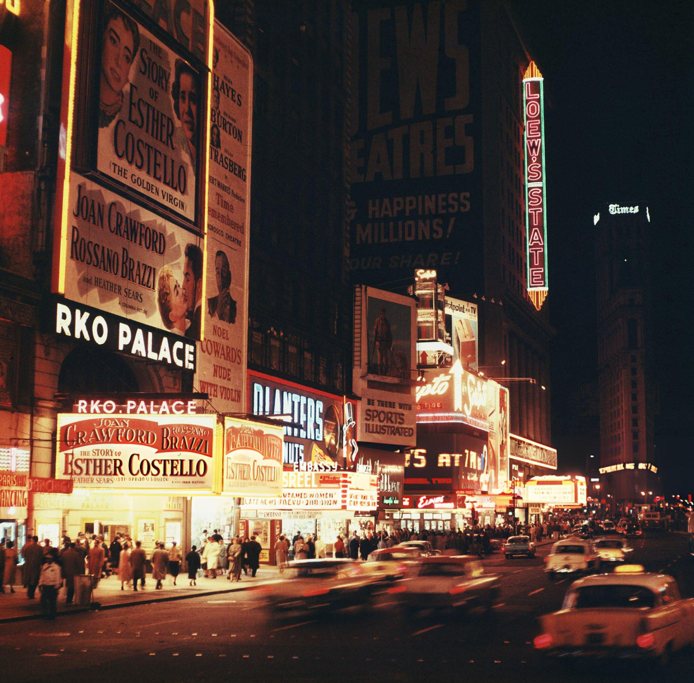 Looking Southeast At Times Square At Dusk. Movie Marquees And Other Neon Signs Are Brightly Lit, 1957.