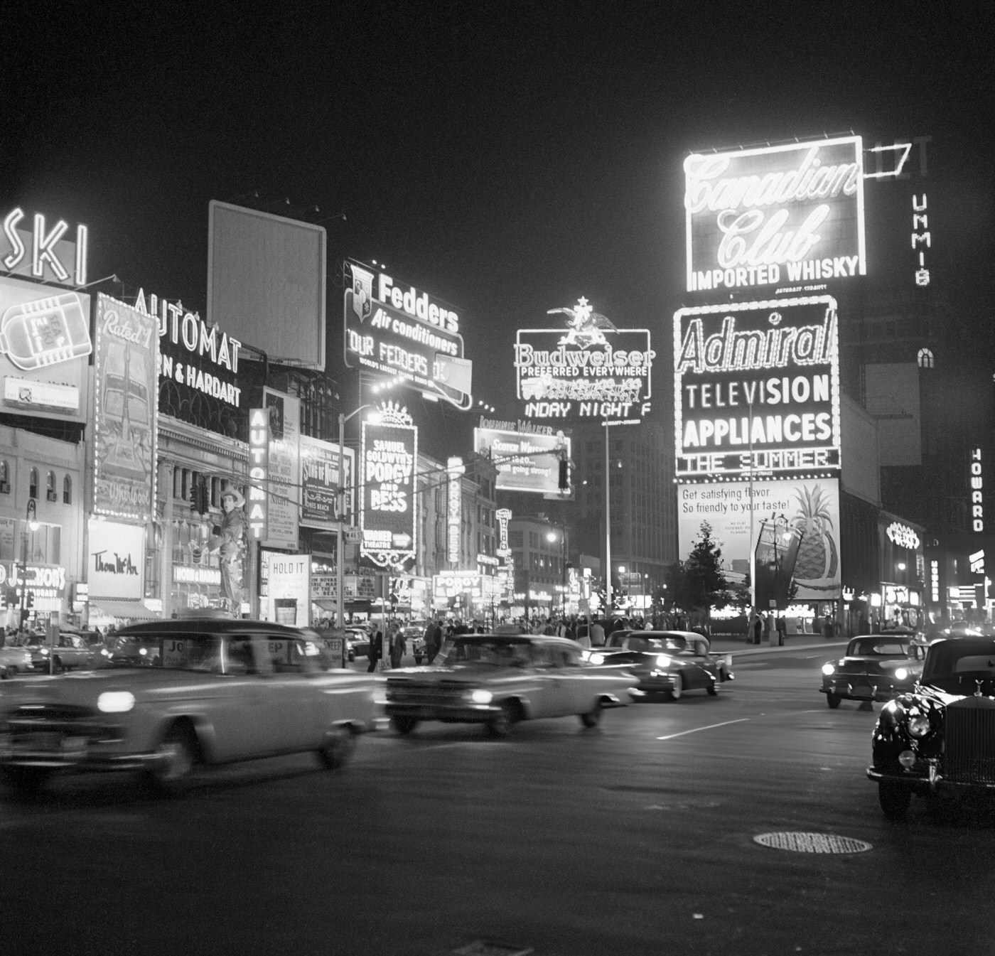 Night Scene In Times Square Showing Street Signs, Lights, Cars, And Theatres, 1959.