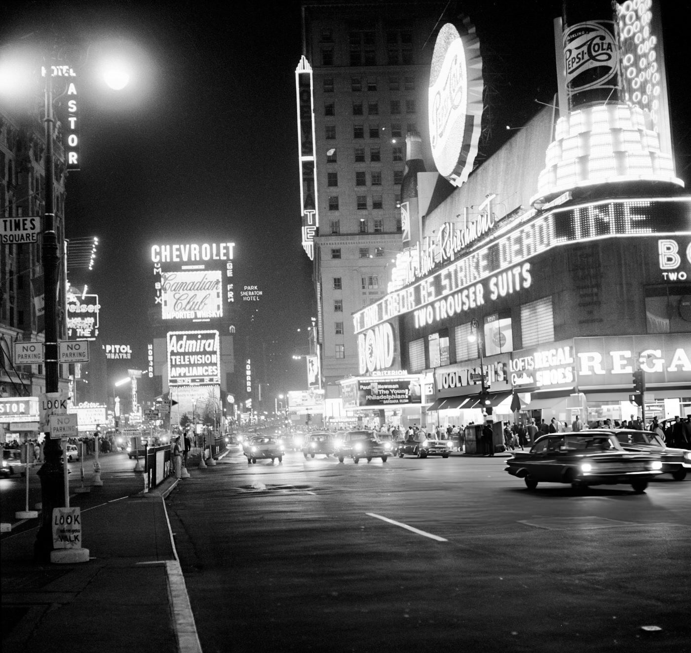 Night Scene In Times Square Showing Street Signs, Lights, Cars, And Theatres, 1959.