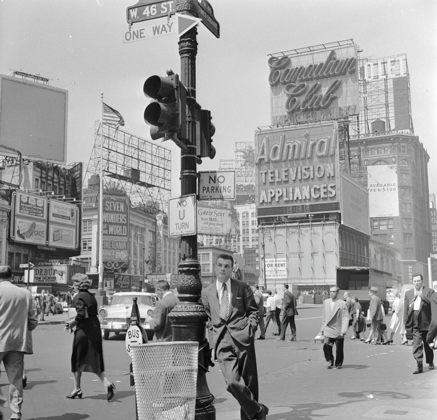 A Salesman Waits In Times Square, Manhattan, New York.