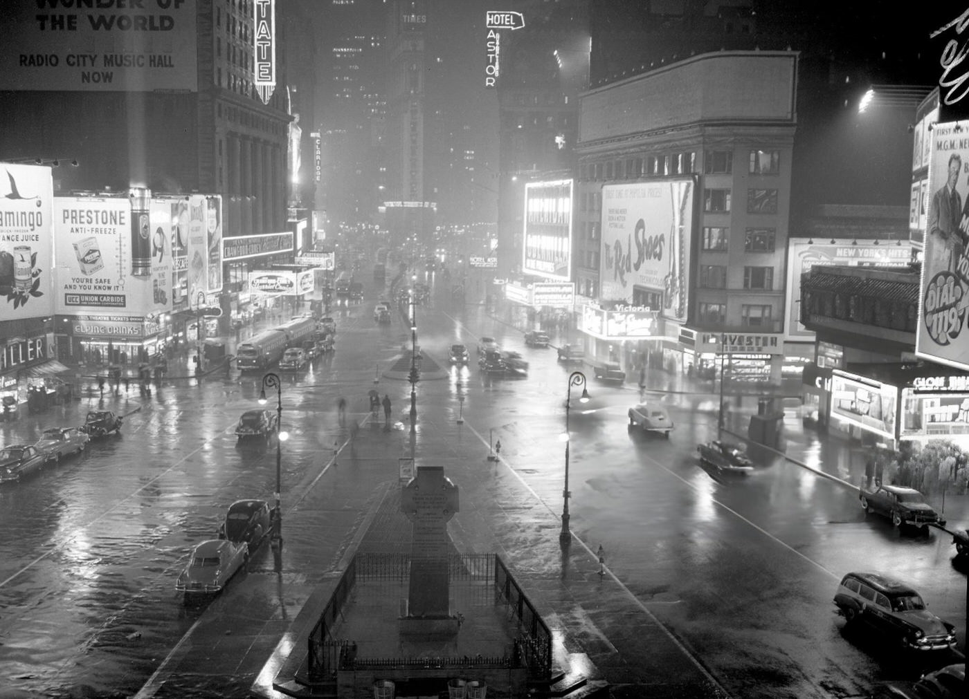 Wet Roads Reflect The Glitter Of Lights In Times Square On A Rainy Night, 1950S.