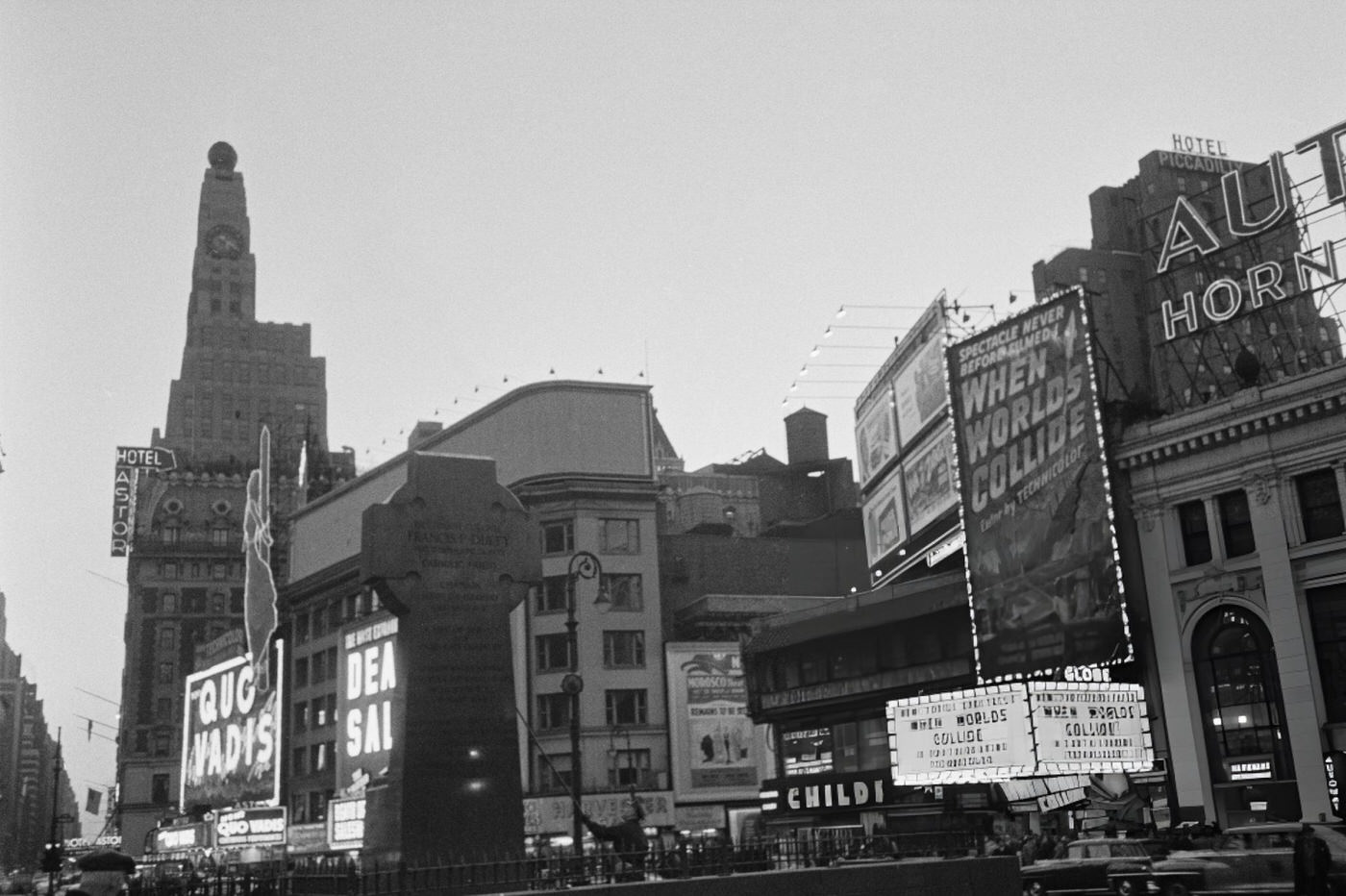 The Celtic Cross Behind The Statue Of Chaplain Francis P Duffy In Father Duffy Square, With The Hotel Astor And Globe Theatre Visible, 1952.
