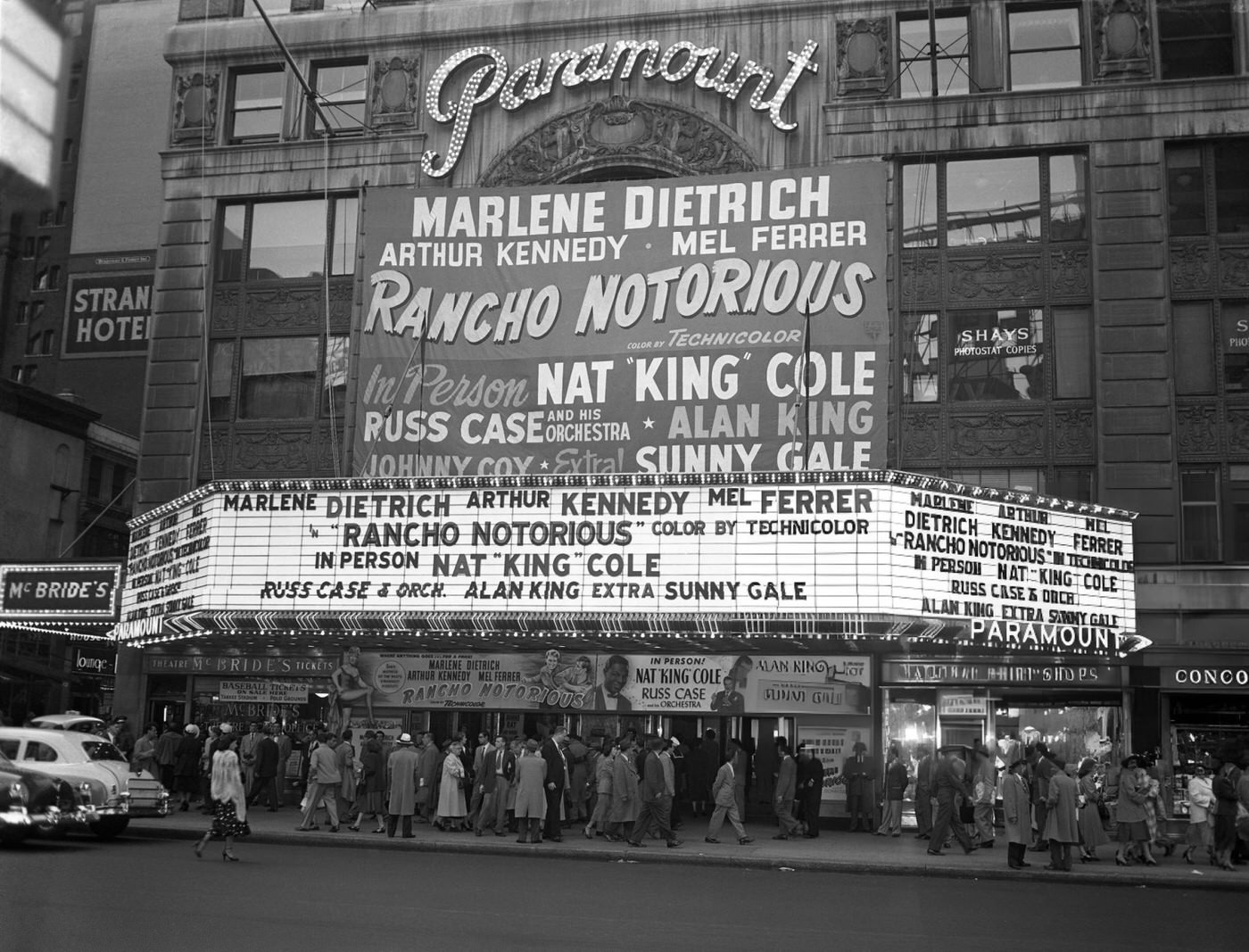 The Marquee Of The Paramount Theatre At 43Rd Street And Broadway In Times Square, Where 'Rancho Notorious' And Nat 'King' Cole Are Playing, May 15, 1952.