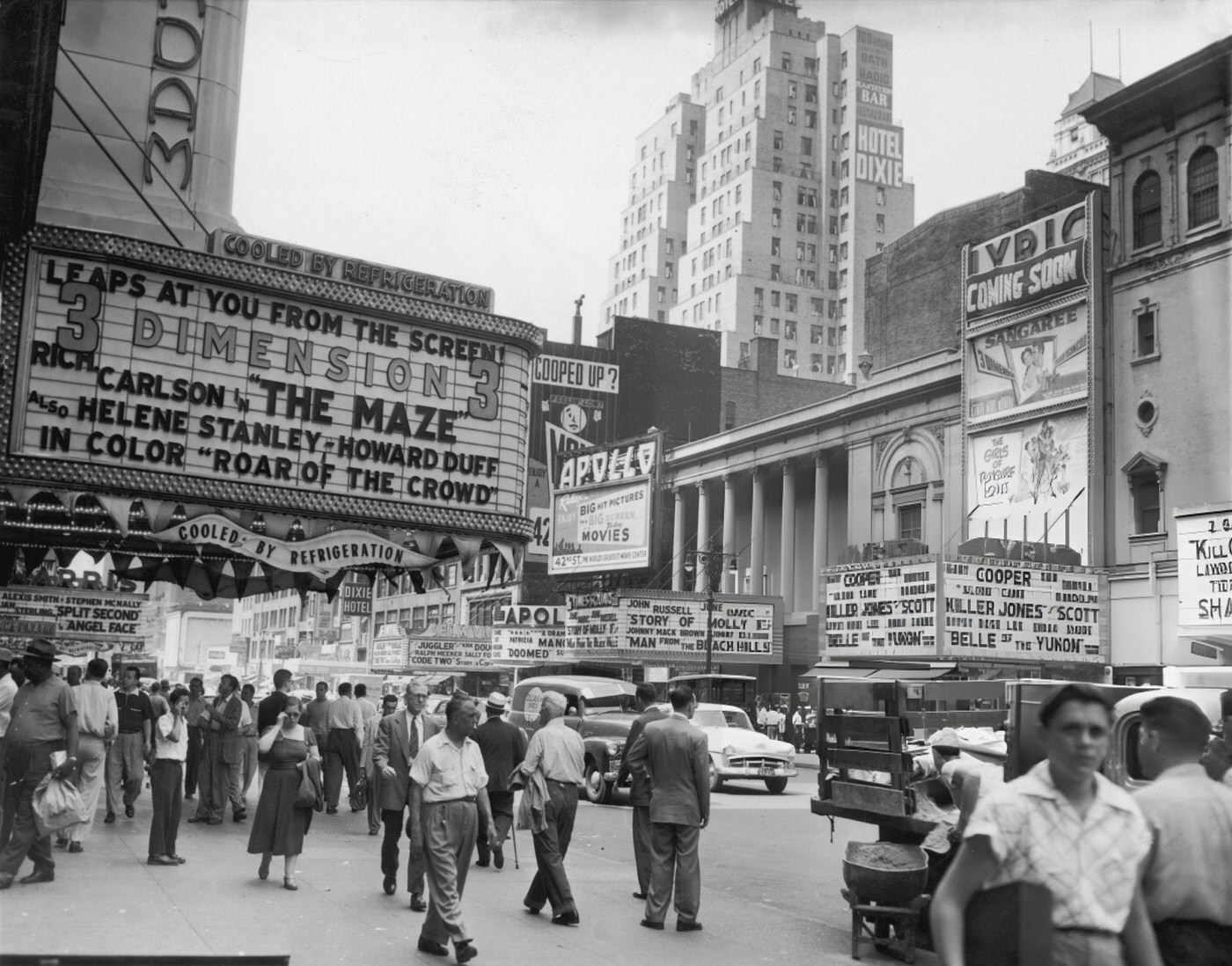 Pedestrians Pass Under Theatre Marquees Along West 42Nd Street In Times Square, Circa 1953.