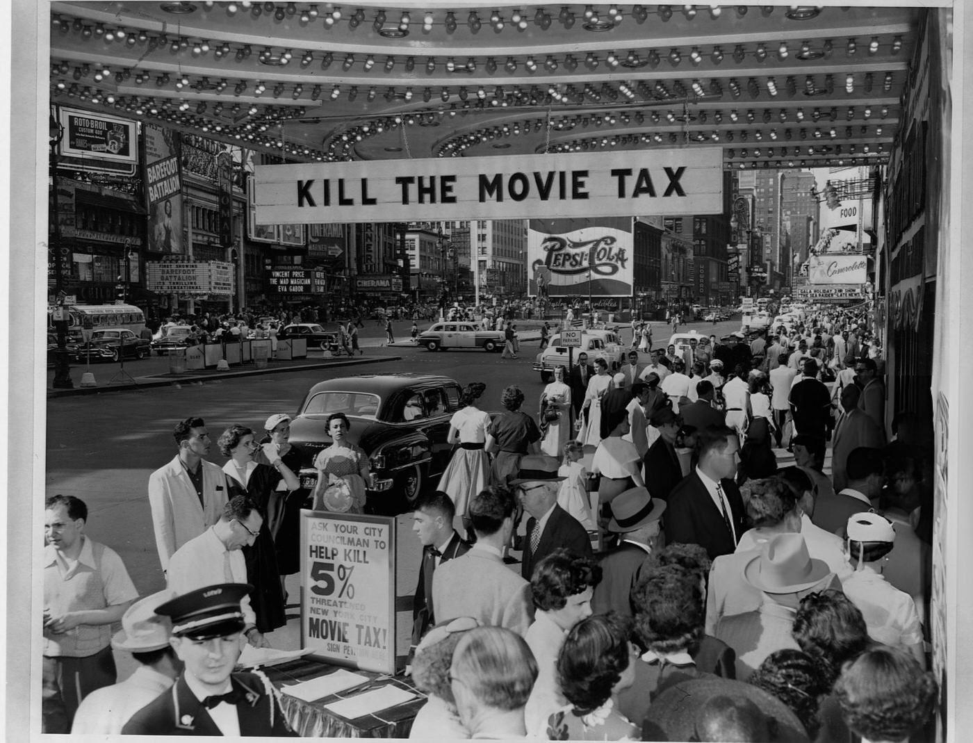 A &Amp;Quot;Hang The Movie Tax&Amp;Quot; Banner Opposing The 5% Tax On Movies Hangs From The Marquee At Loew'S State Theater In Times Square.