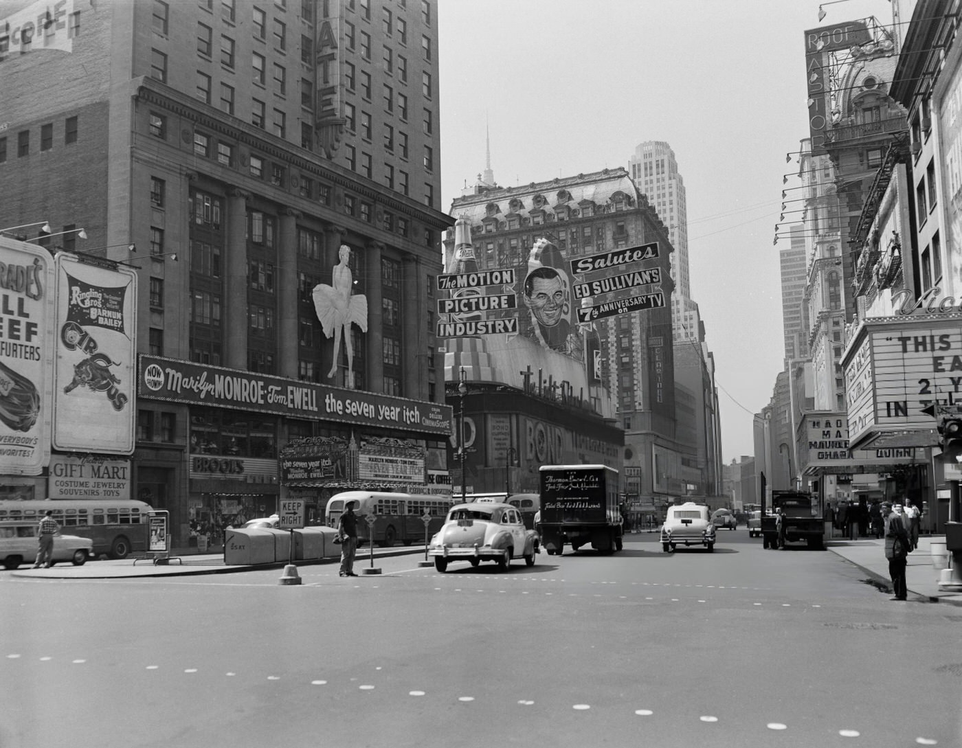 Advertising In Times Square, With A Banner Saluting Ed Sullivan'S 7Th Anniversary On Tv, And The Marilyn Monroe Film 'The Seven Year Itch' Showing, 1955.
