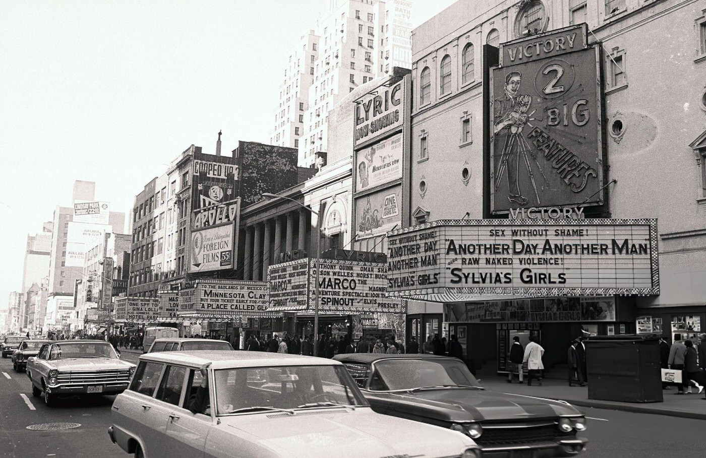 View Of 42Nd Street In New York City, Showing Times Square With Marquees On A Busy Street.