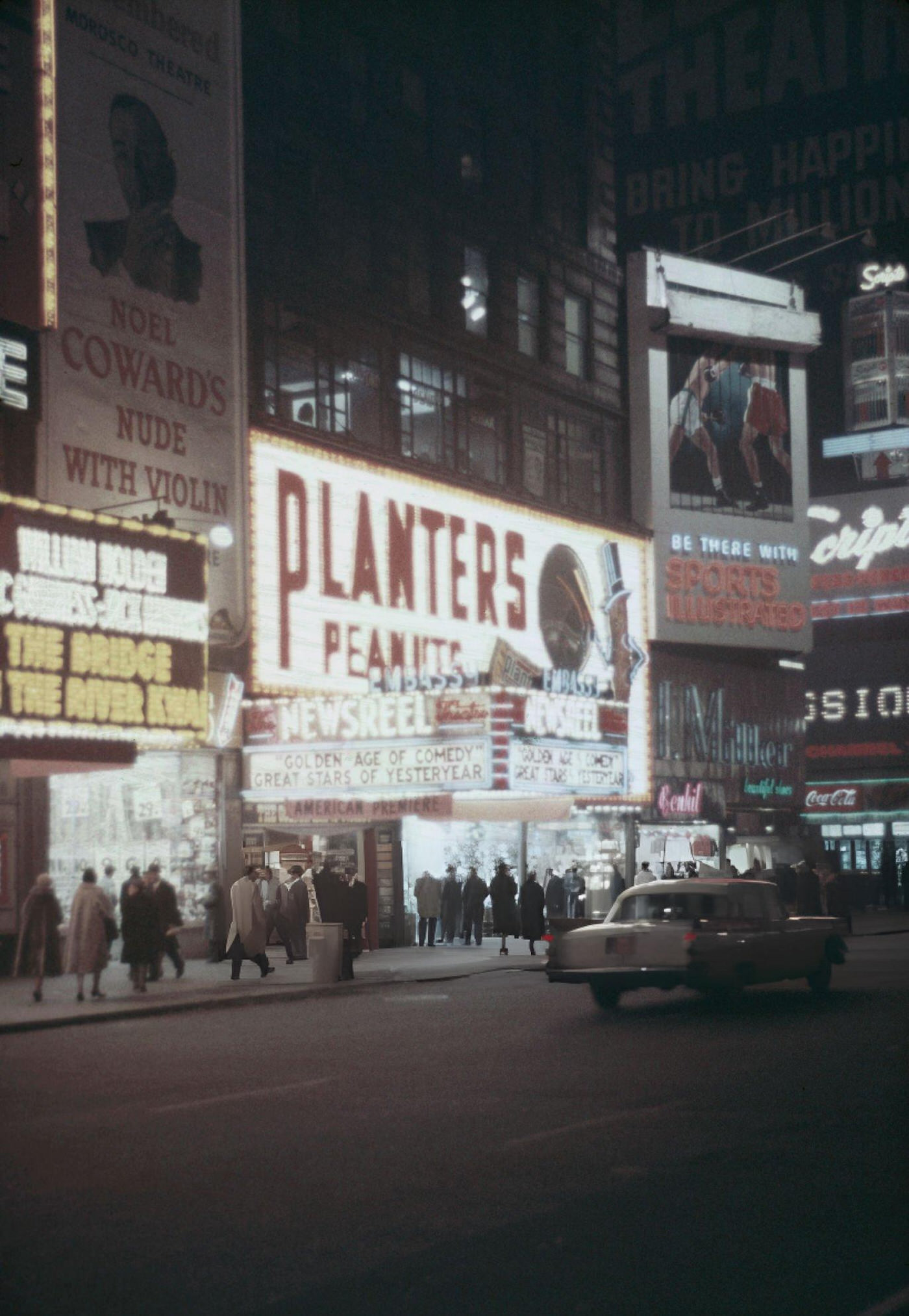 Various Advertisements For Films, Plays, And Planters Peanuts Illuminated At Night In Times Square, 1957.