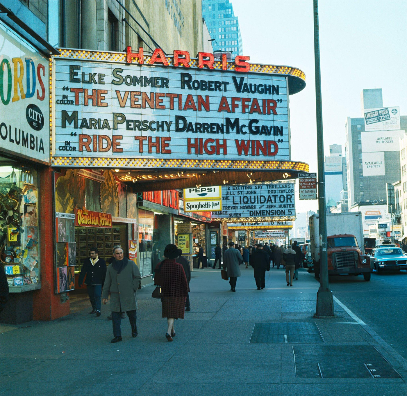 Times Square Area With Souvenir Shops, Movie Theaters, And Book Stores, Showing A Marquee Advertising A Double Bill.